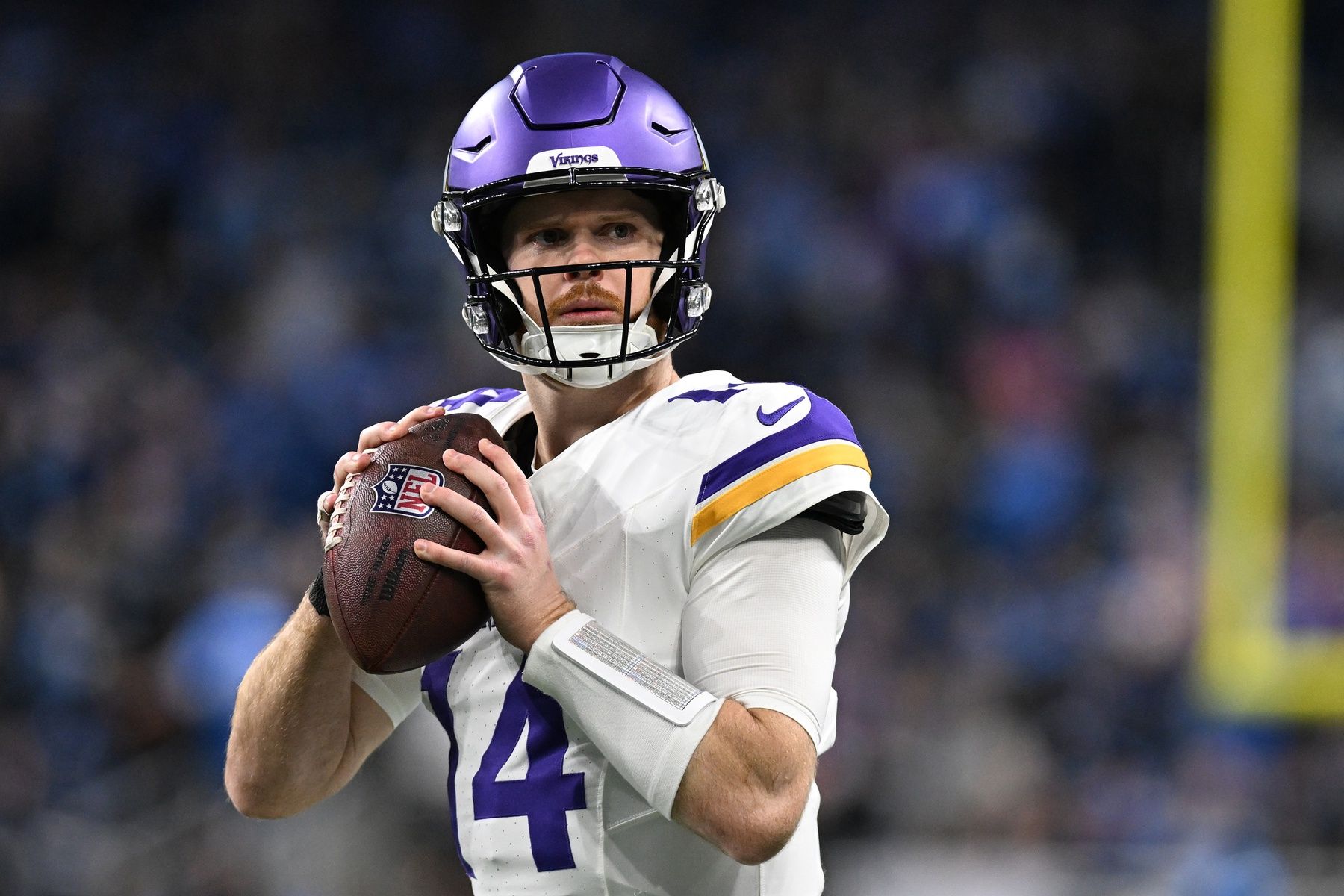 Minnesota Vikings quarterback Sam Darnold (14) throws passes during pregame warmups before their game against the Detroit Lions at Ford Field.