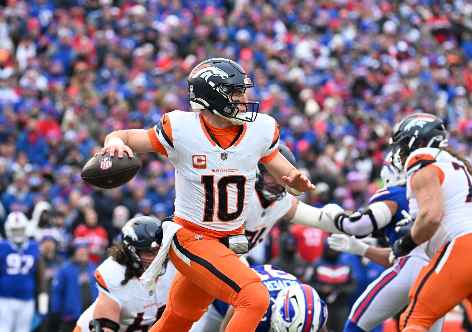 Denver Broncos quarterback Bo Nix (10) throws downfield during the second quarter against the Buffalo Bills in an AFC wild card game at Highmark Stadium.