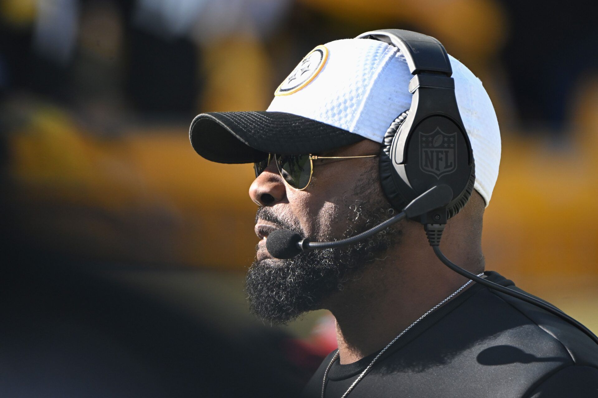 Pittsburgh Steelers head coach Mike Tomlin watches player introductions for a game against the Cleveland Browns at Acrisure Stadium.