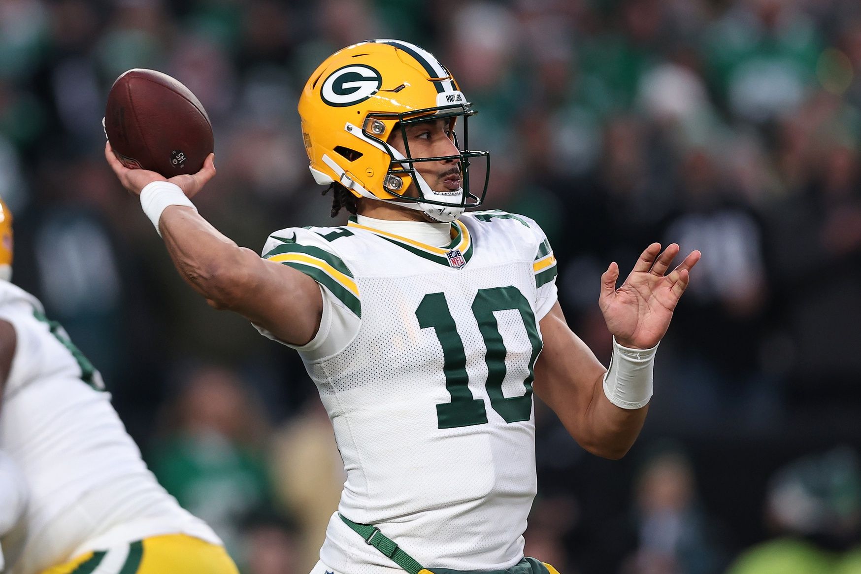 Green Bay Packers quarterback Jordan Love (10) drops back to pass against the Philadelphia Eagles during the first quarter in the NFC wild card game at Lincoln Financial Field.