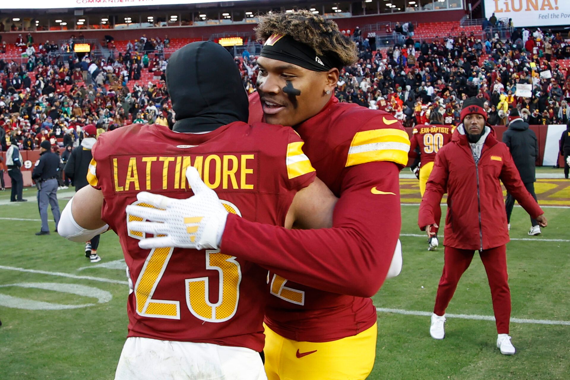 Dec 22, 2024; Landover, Maryland, USA; Washington Commanders cornerback Marshon Lattimore (23) celebrates with Commanders linebacker Mykal Walker (32) after their game against the Philadelphia Eagles at Northwest Stadium. Mandatory Credit: Geoff Burke-Imagn Images