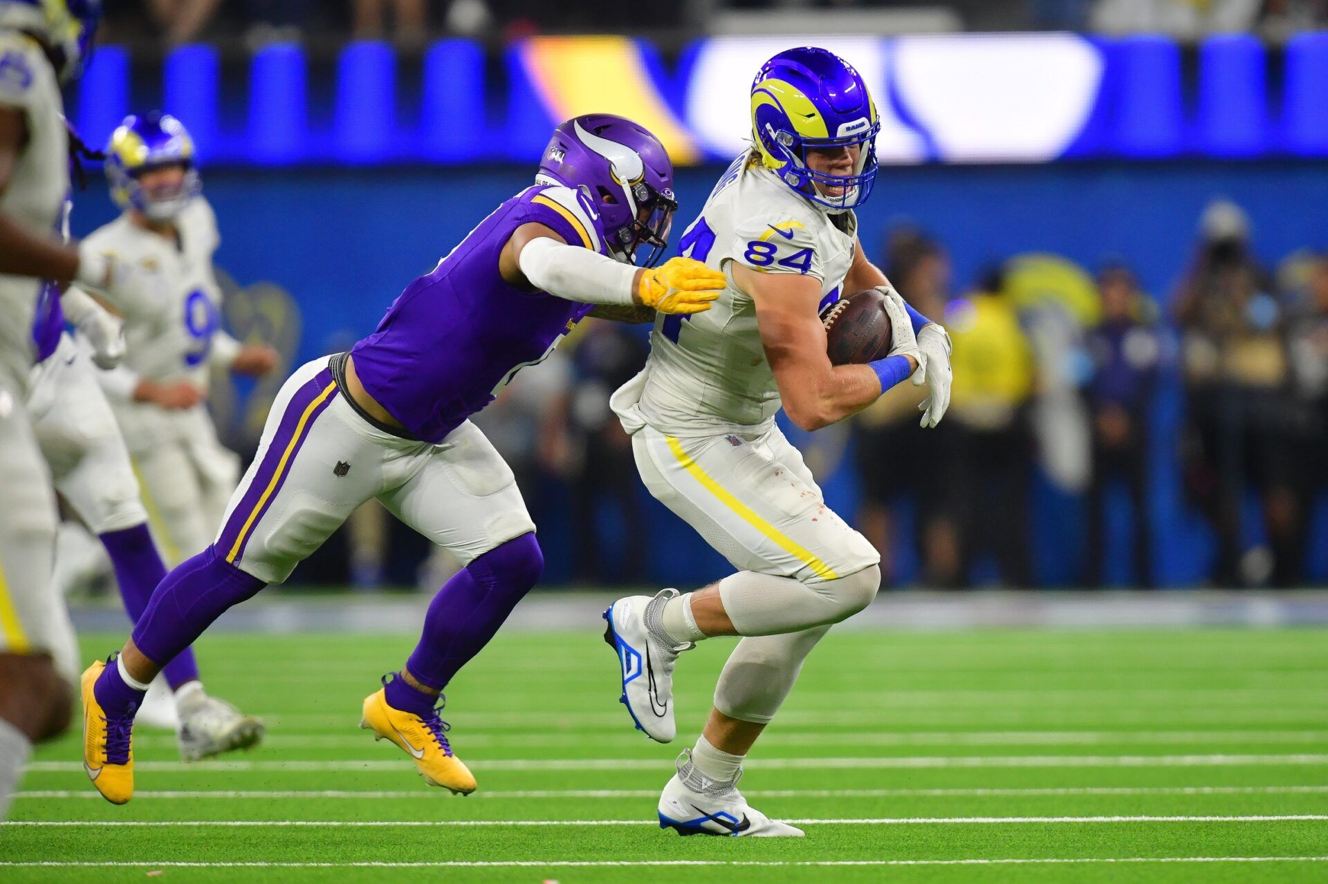 Los Angeles Rams tight end Hunter Long (84) runs the ball ahead of Minnesota Vikings linebacker Ivan Pace Jr. (0) during the second half at SoFi Stadium.