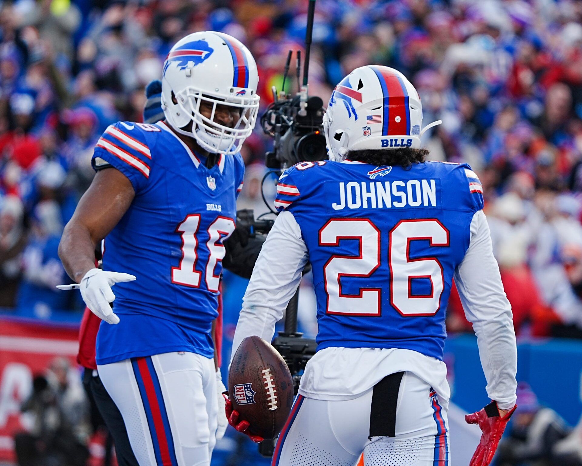 Buffalo Bills wide receiver Amari Cooper (18) celebrates with Buffalo Bills running back Ty Johnson (26) Johnson’s touchdown during the second half of the Buffalo Bills wild card game against the Denver Broncos at Highmark Stadium in Orchard Park on Jan. 12, 2025.