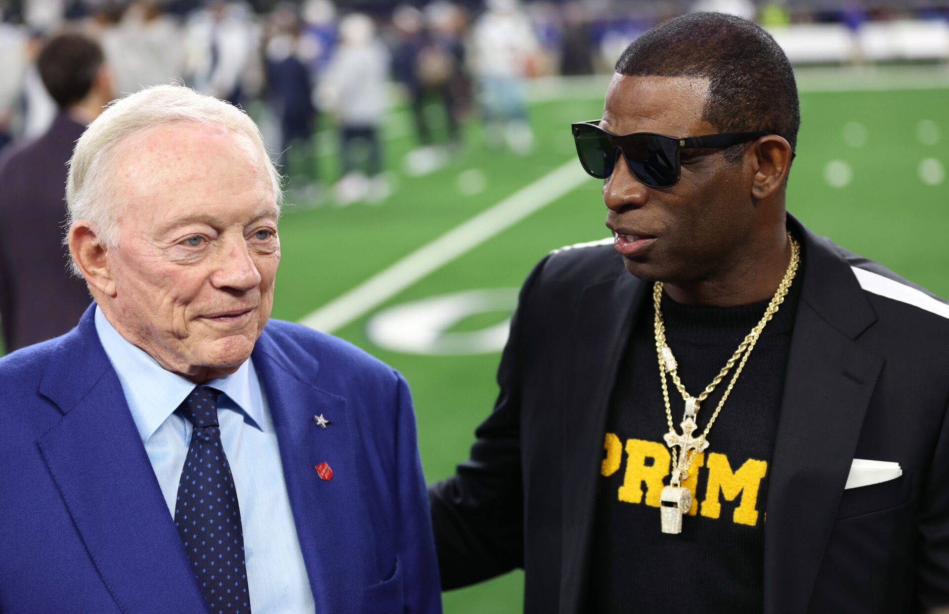 Nov 30, 2023; Arlington, Texas, USA; Colorado Buffaloes head coach Deion Sanders (right) talks with Dallas Cowboys owner Jerry Jones before the game against the Seattle Seahawks at AT&T Stadium. Mandatory Credit: Tim Heitman-USA TODAY Sports