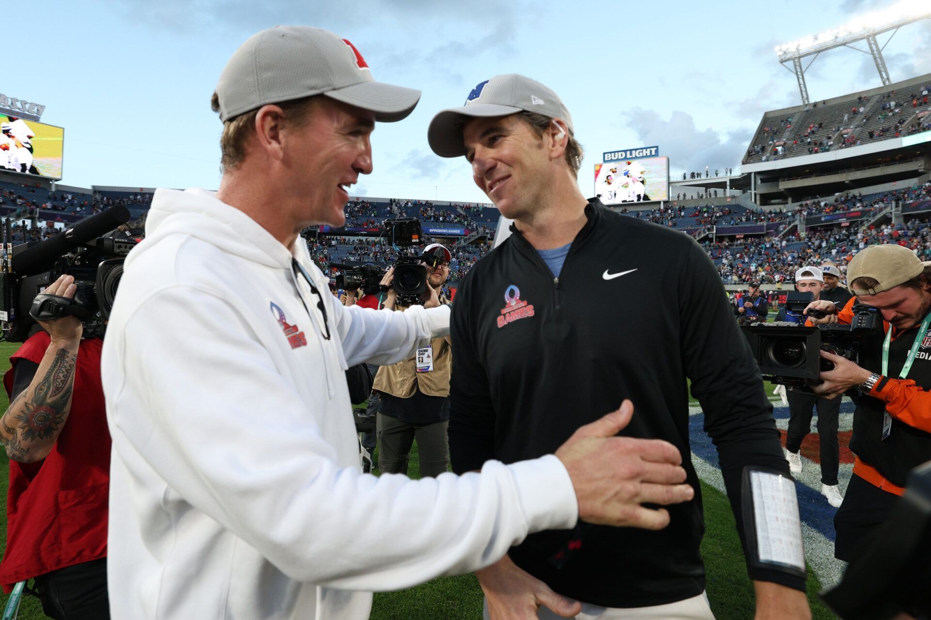 NFC coach Eli Manning and AFC coach Peyton Manning react after the 2024 Pro Bowl at Camping World Stadium.