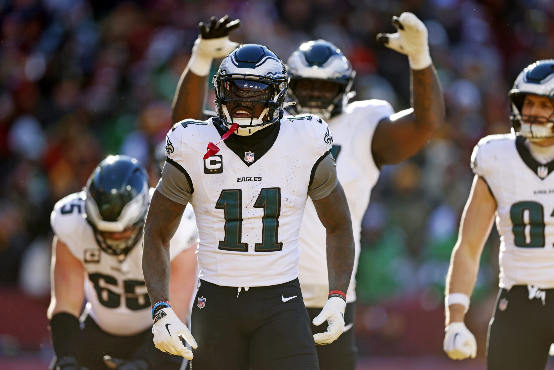 Philadelphia Eagles wide receiver A.J. Brown (11) celebrates after scoring a touchdown during the first quarter against the Washington Commanders at Northwest Stadium.