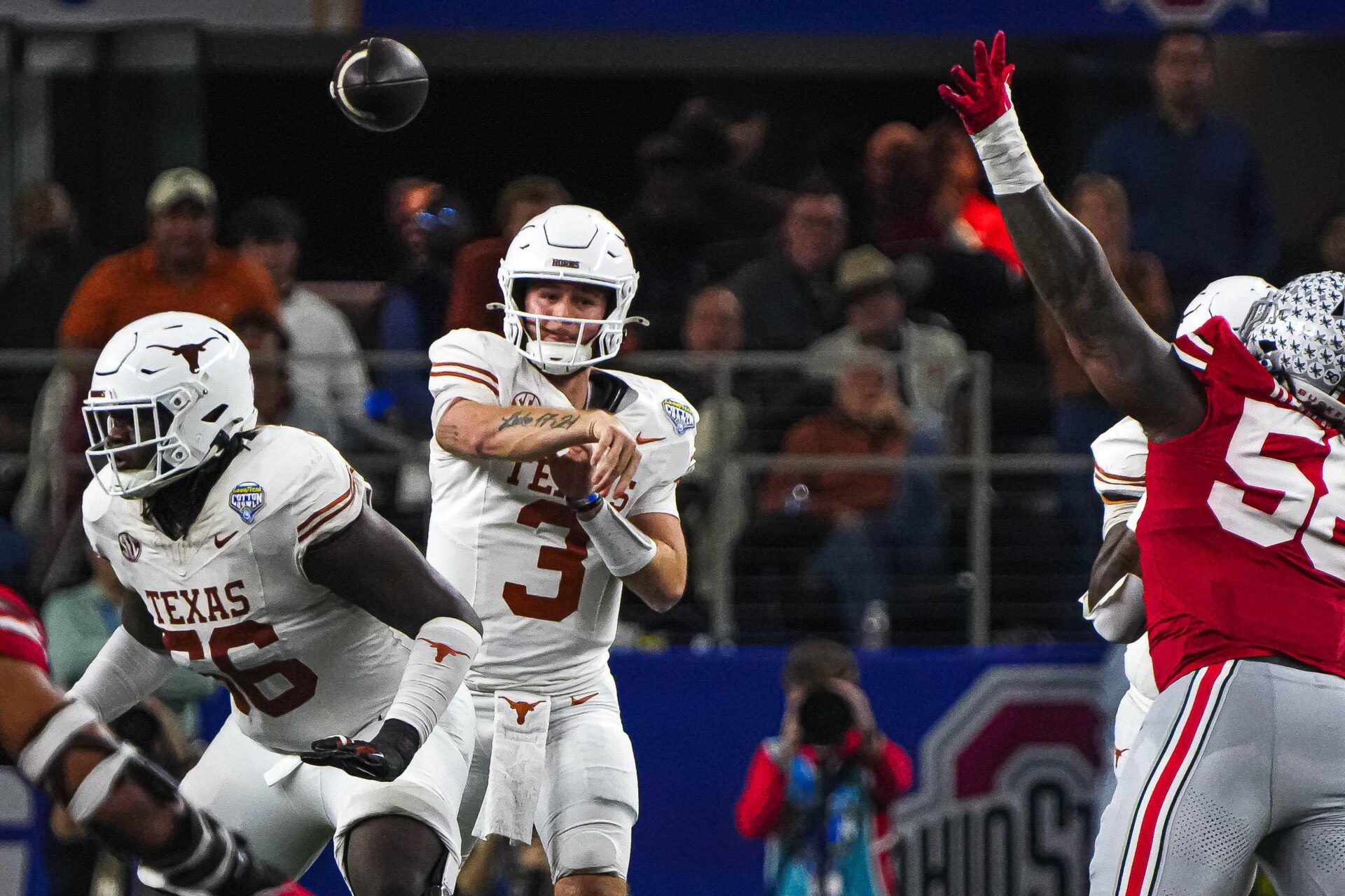 Texas Longhorns quarterback Quinn Ewers (3) throws a pass during the College Football Playoff semifinal game against Ohio State in the Cotton Bowl at AT&T Stadium on Friday, Jan. 10, 2024 in Arlington, Texas.