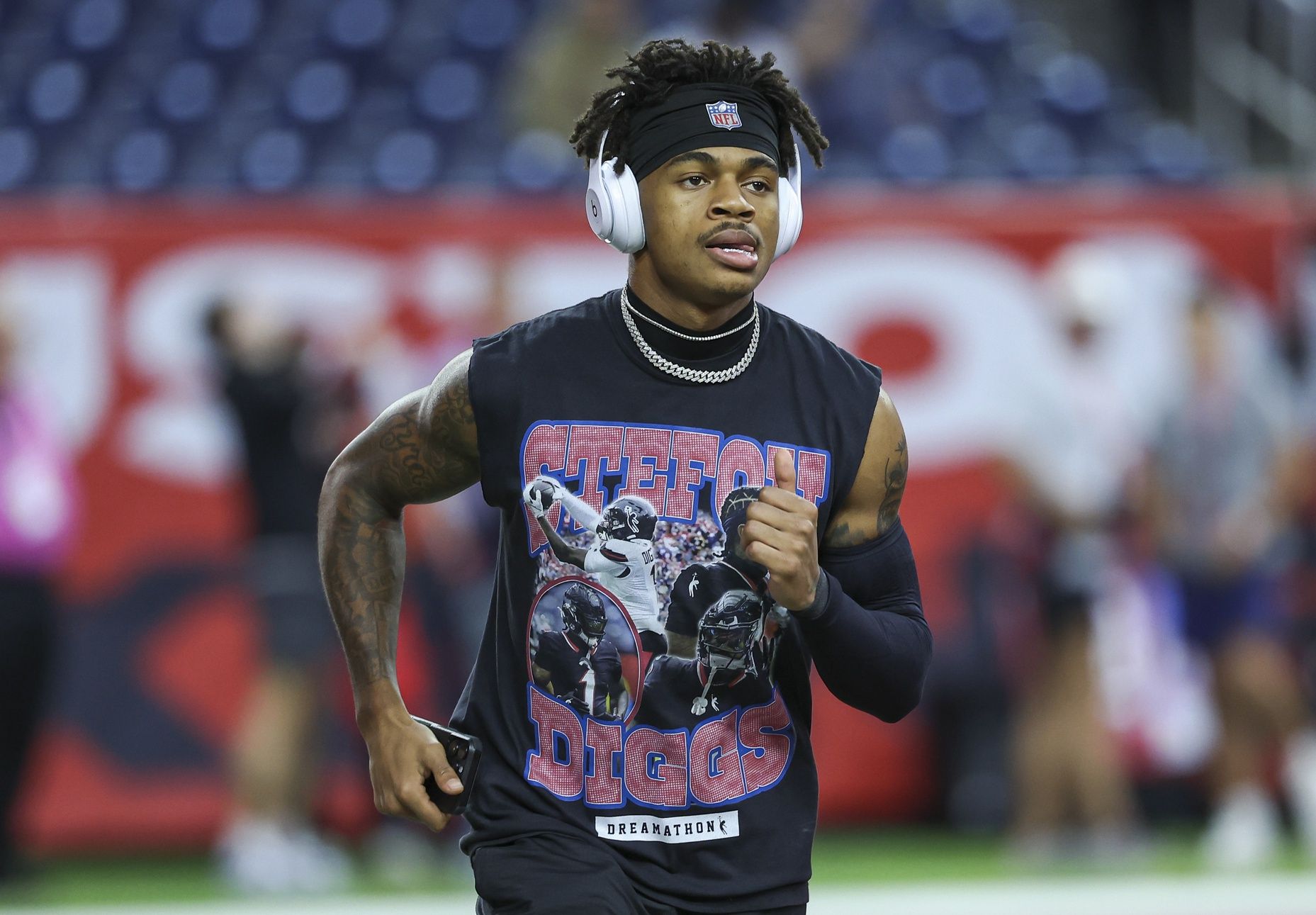 Houston Texans wide receiver Tank Dell (3) wears a shirt with wide receiver Stefon Diggs (1) before the game against the Detroit Lions at NRG Stadium.