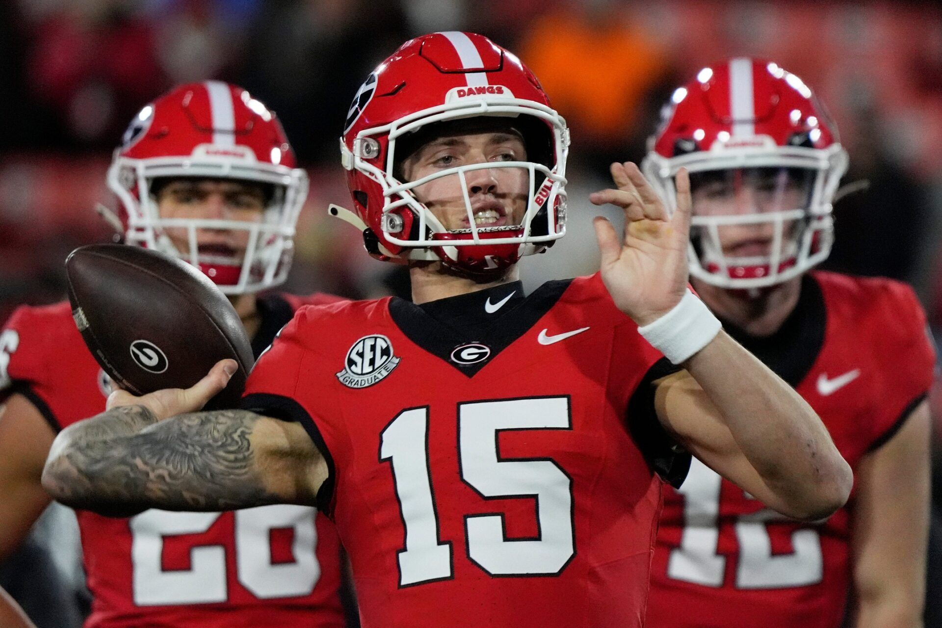 Georgia quarterback Carson Beck (15) warms up before the start of a NCAA college football game against Georgia Tech in Athens, Ga., on Friday, Nov. 29, 2024.