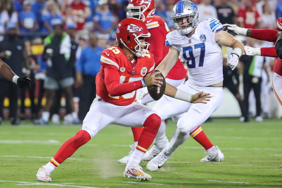 Detroit Lions defensive end Aidan Hutchinson looks to tackle Kansas City Chiefs quarterback Patrick Mahomes during the second half at Arrowhead Stadium.