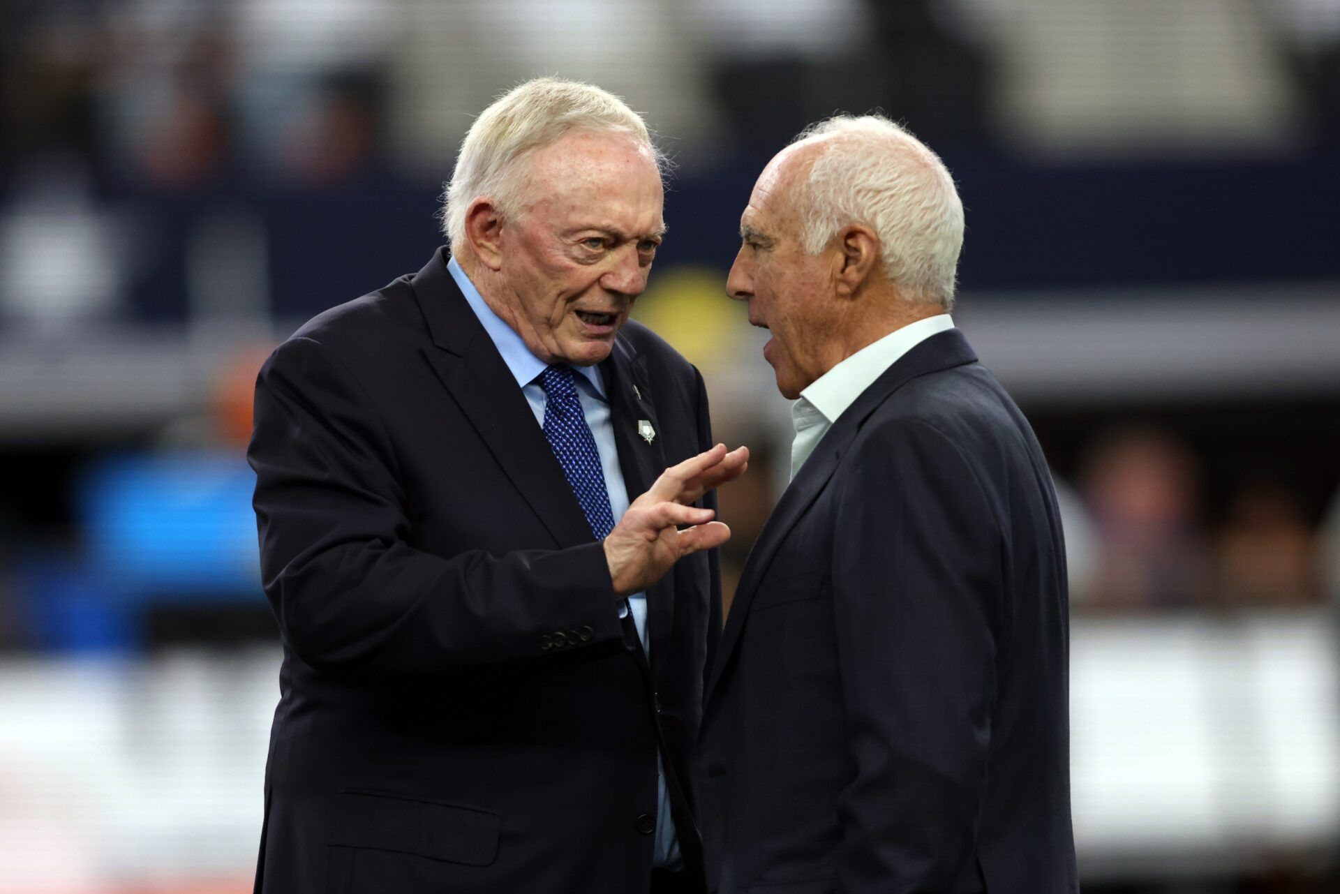 Dallas Cowboys owner Jerry Jones talks to Philadelphia Eagles owner Jeffrey Lurie before the game at AT&T Stadium.