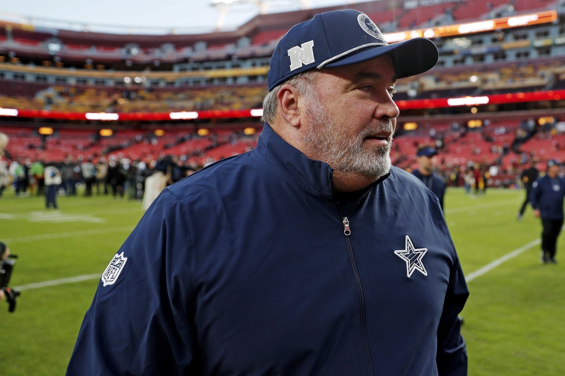 Dallas Cowboys head coach Mike McCarthy leaves the field after the game between the Washington Commanders and the Dallas Cowboys at Northwest Stadium.