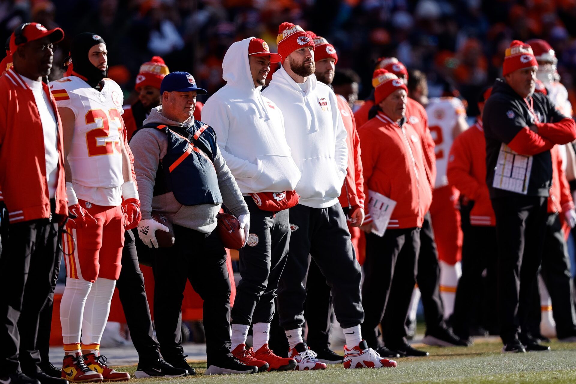 Kansas City Chiefs quarterback Patrick Mahomes (L) and tight end Travis Kelce (R) look on in the first quarter against the Denver Broncos at Empower Field at Mile High.