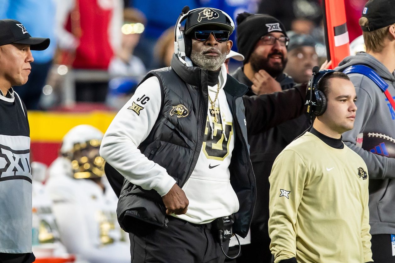 Colorado head coach Deion Sanders watches the run of play during the 3rd quarter between the Kansas Jayhawks and the Colorado Buffaloes at GEHA Field at Arrowhead Stadium.