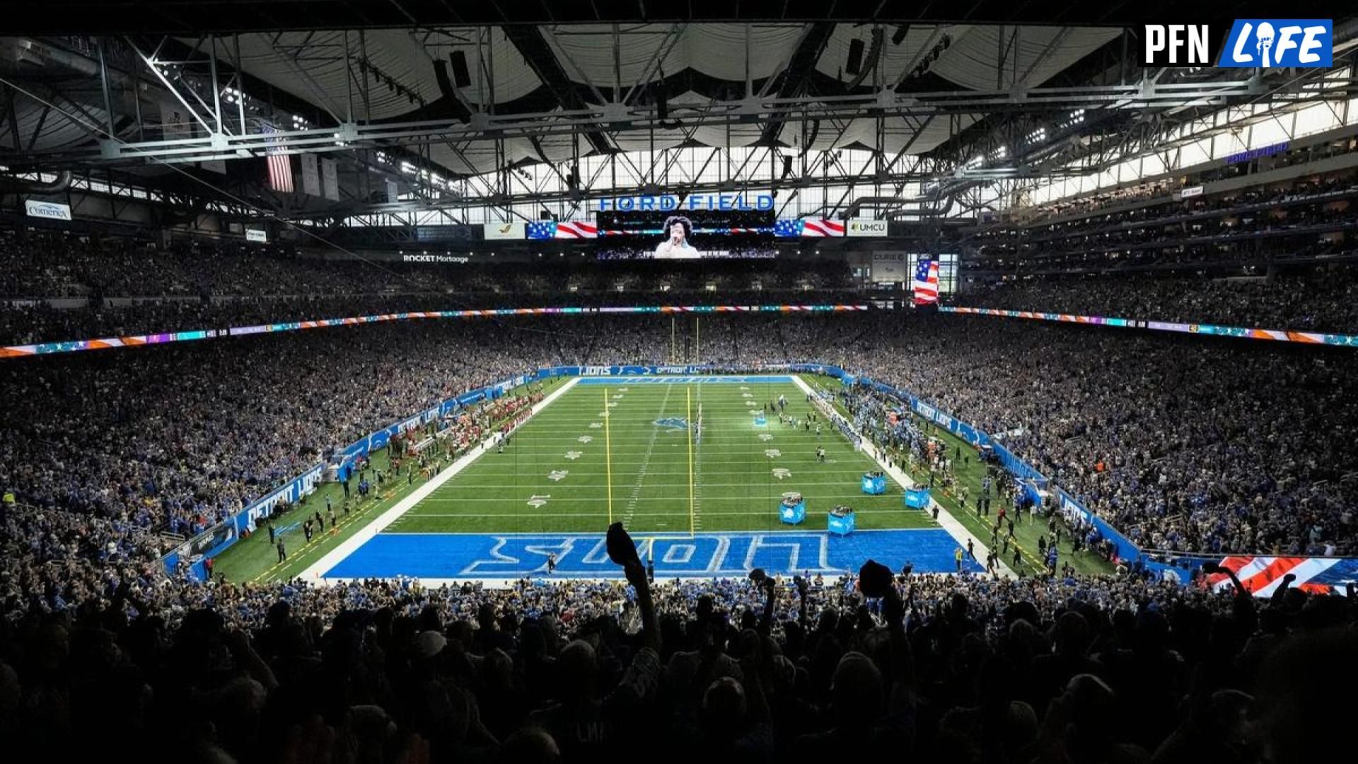 Football fans cheer on during the national anthem before the game between Detroit Lions and Tampa Bay Buccaneers at Ford Field in Detroit on Sunday, September 15, 2024.