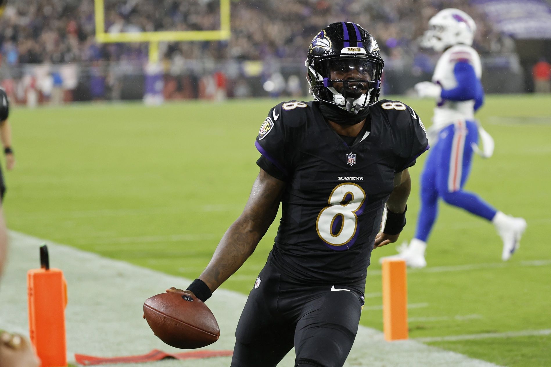 Baltimore Ravens quarterback Lamar Jackson (8) celebrates after scoring a touchdown against the Buffalo Bills at M&T Bank Stadium.