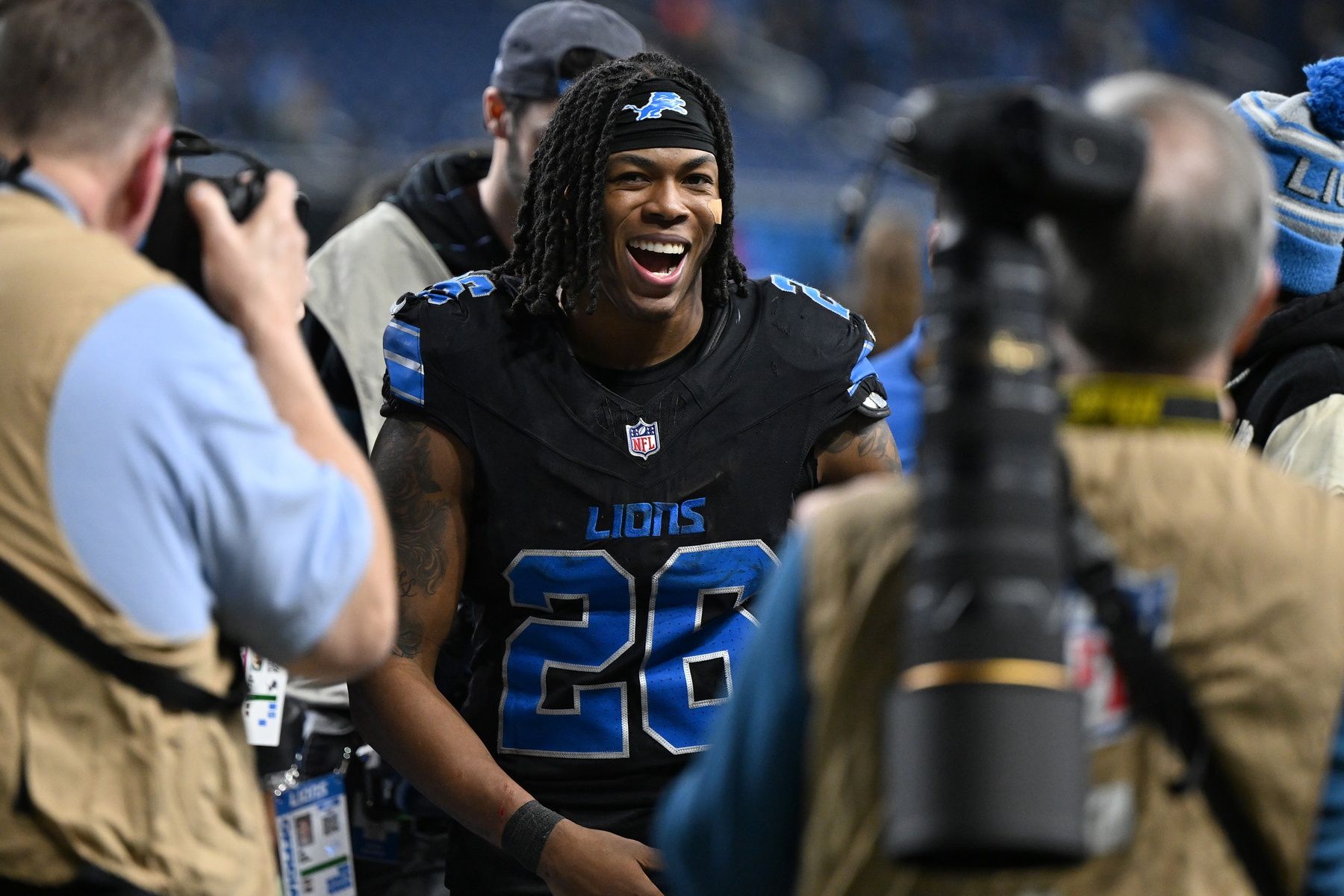 Detroit Lions running back Jahmyr Gibbs (26) celebrates as he runs off the field following the Lions win over the Minnesota Vikings at Ford Field.