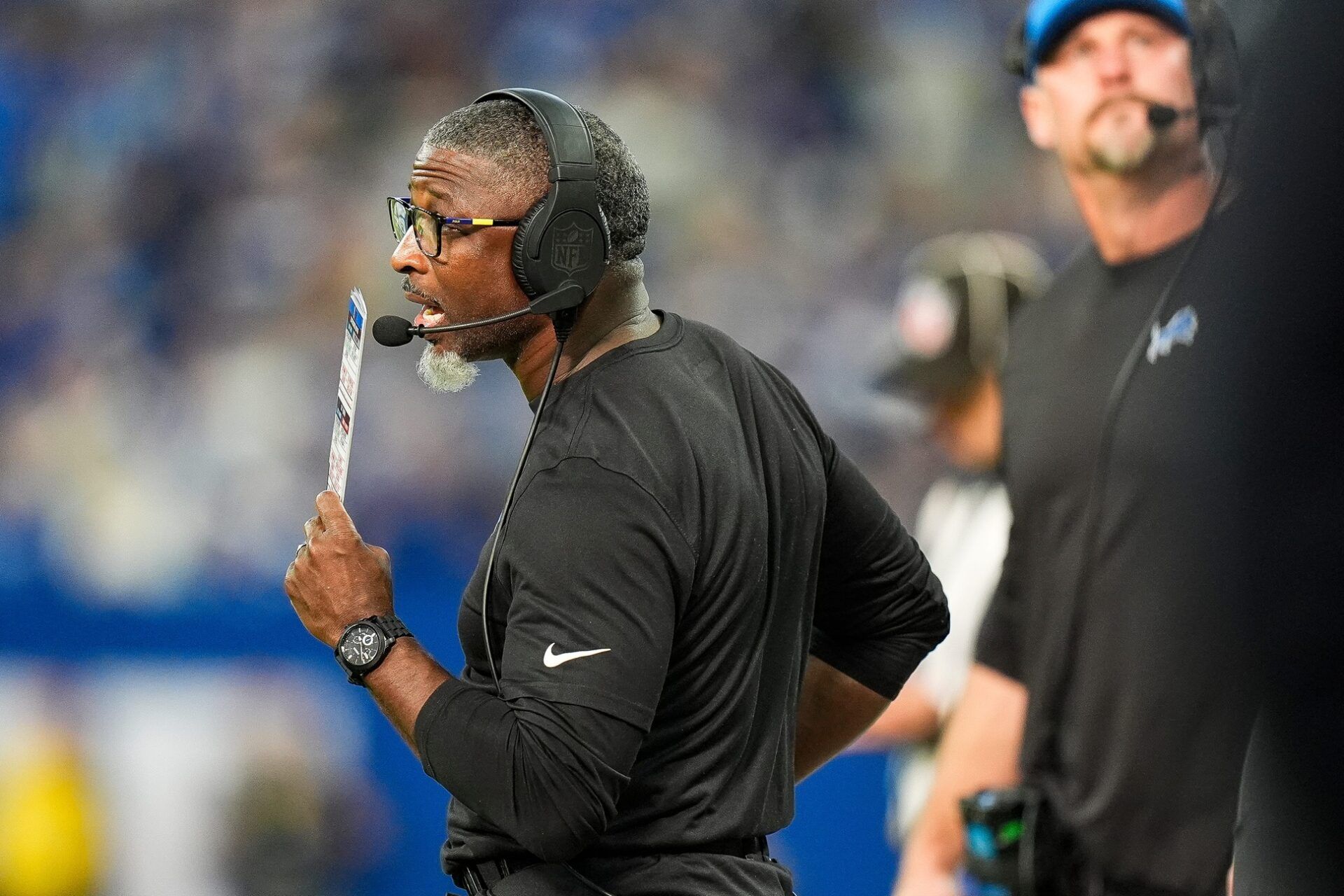 Detroit Lions defensive coordinator Aaron Glenn watches a play against Indianapolis Colts during the second half at Lucas Oil Stadium in Indianapolis, Ind. on Sunday, Nov. 24, 2024.