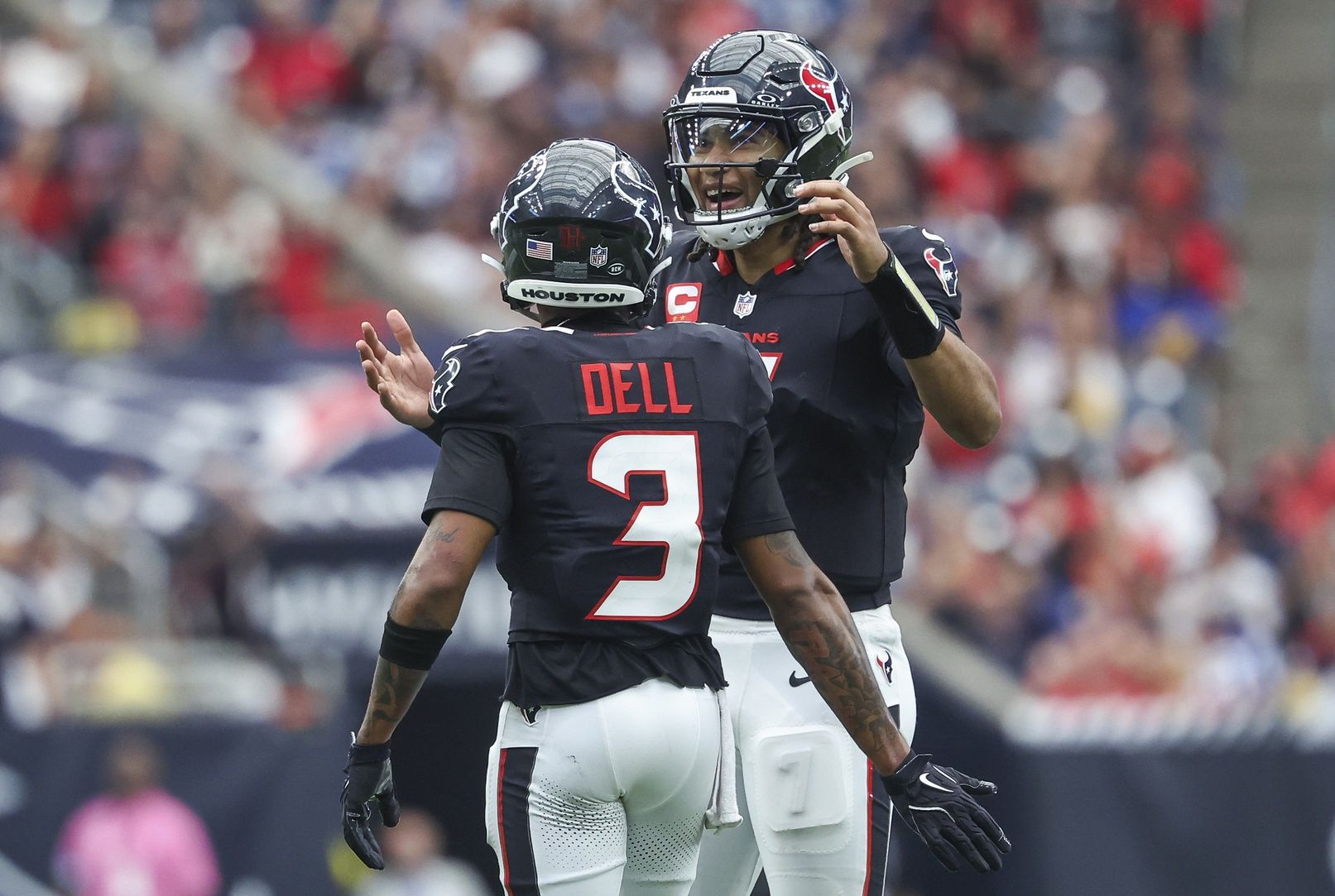 Houston Texans quarterback C.J. Stroud (7) and wide receiver Tank Dell (3) react after a play during the fourth quarter against the Indianapolis Colts at NRG Stadium.