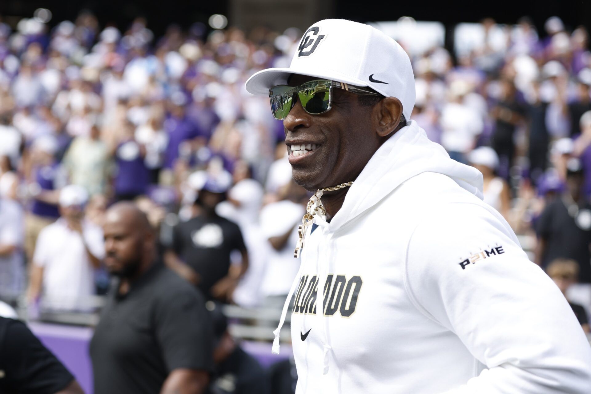 Colorado Buffaloes head coach Deion Sanders runs on the field before the game against the TCU Horned Frogs at Amon G. Carter Stadium.