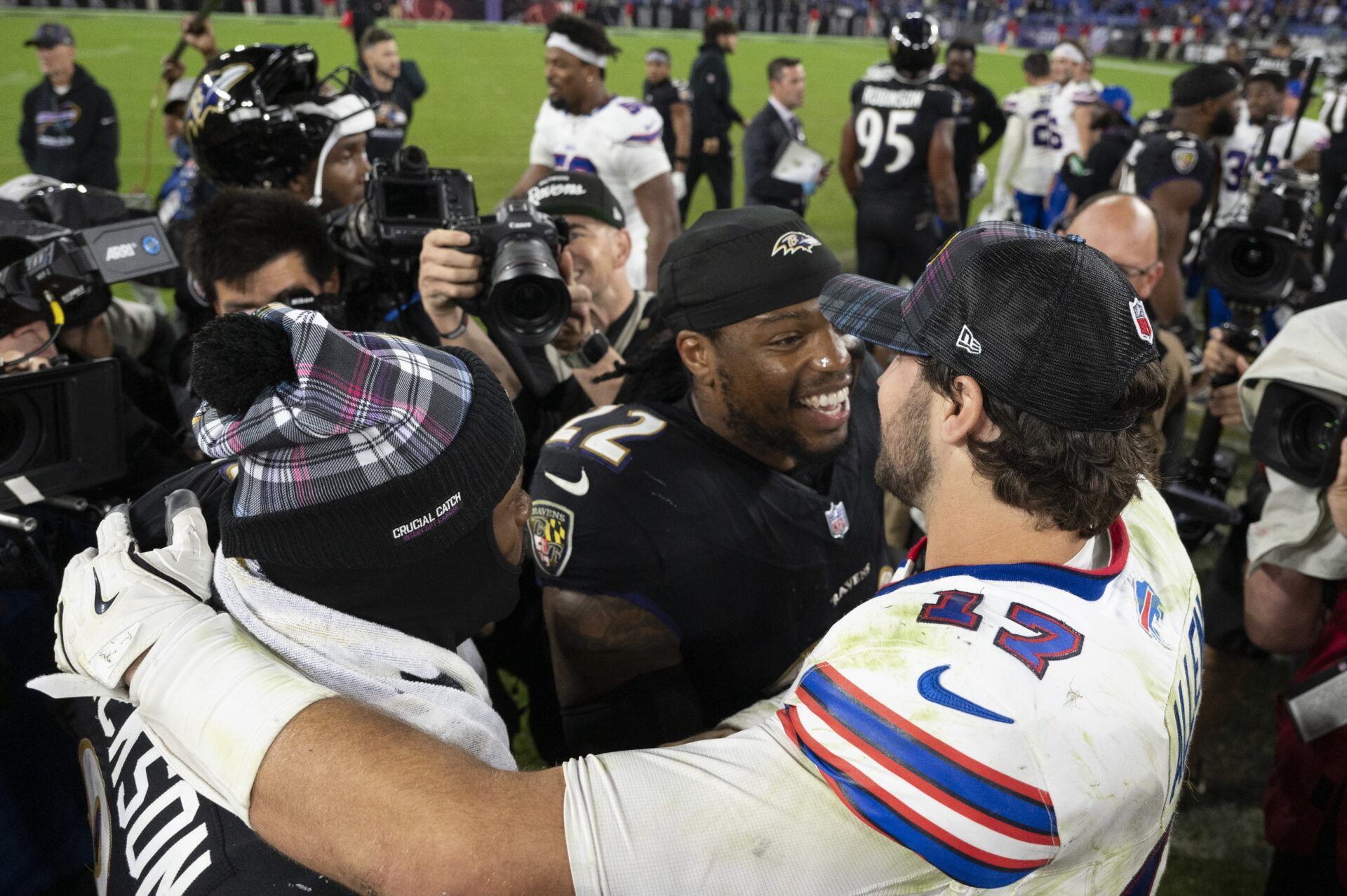 Buffalo Bills quarterback Josh Allen (17) speaks with Baltimore Ravens running back Derrick Henry (22) and quarterback Lamar Jackson (8) after the game during the second half at M&T Bank Stadium.