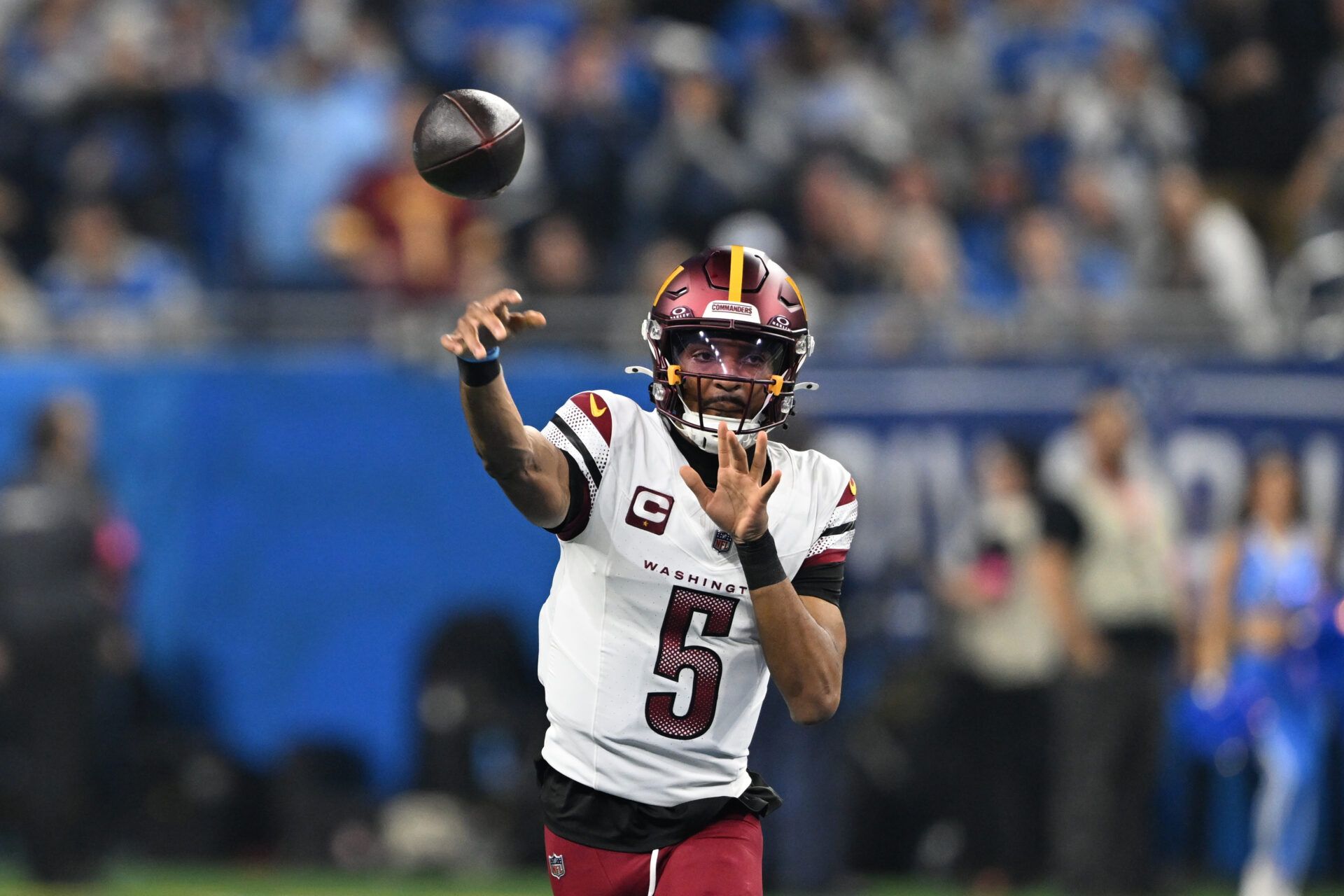 Jan 18, 2025; Detroit, Michigan, USA; Washington Commanders quarterback Jayden Daniels (5) throws a pass during the first quarter against Detroit Lions in a 2025 NFC divisional round game at Ford Field. Mandatory Credit: Lon Horwedel-Imagn Images