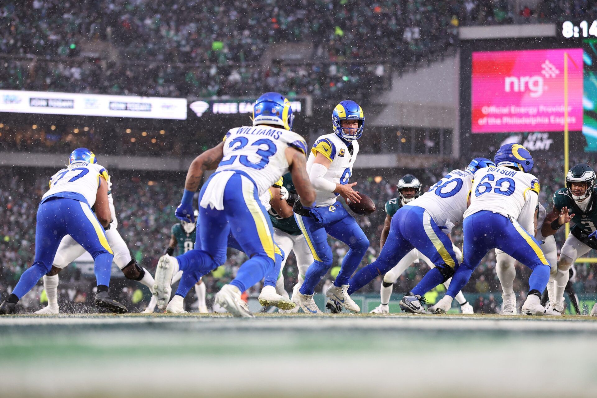 Los Angeles Rams quarterback Matthew Stafford (9) prepares to hand the ball to Los Angeles Rams running back Kyren Williams (23) against the Philadelphia Eagles during the first half in a 2025 NFC divisional round game at Lincoln Financial Field.