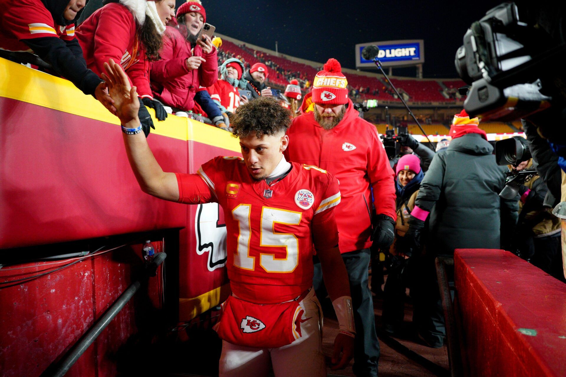 Kansas City Chiefs quarterback Patrick Mahomes (15) shakes hands with fans after defeating the Houston Texans in a 2025 AFC divisional round game at GEHA Field at Arrowhead Stadium.