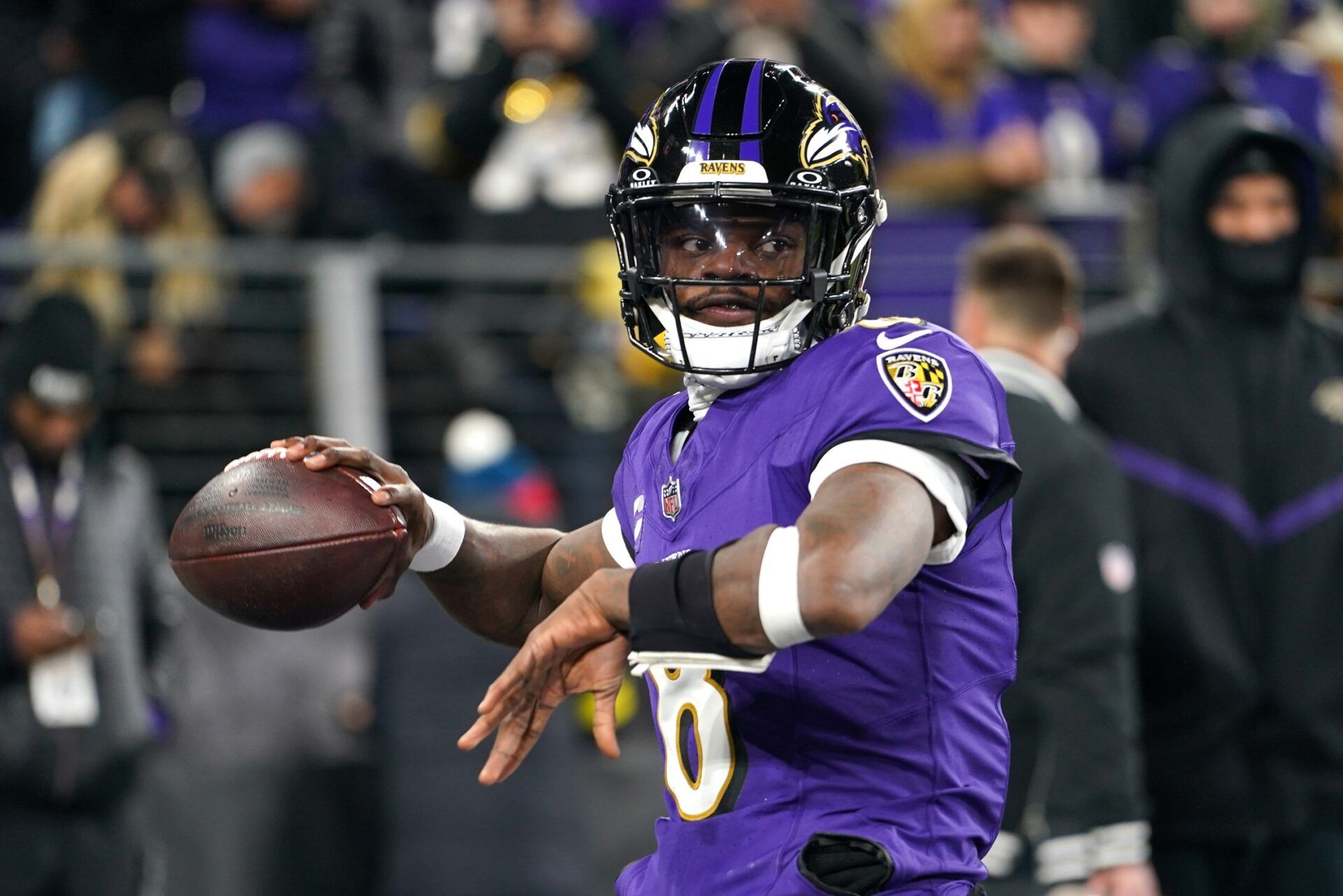 Baltimore Ravens quarterback Lamar Jackson (8) warms up before an AFC wild card game against the Pittsburgh Steelers at M&T Bank Stadium.