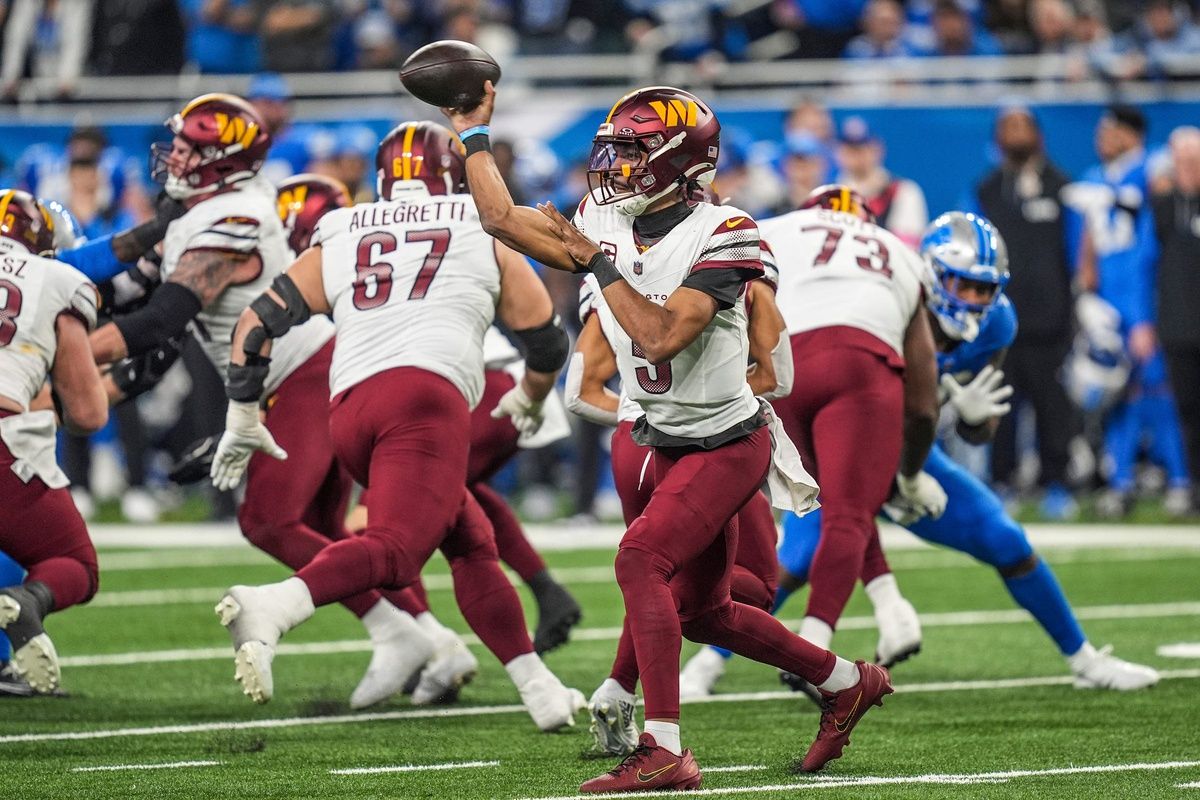 Washington Commanders quarterback Jayden Daniels looks to pass against the Detroit Lions in the first half of the NFC divisional round playoff game at Ford Field in Detroit on Saturday, Jan. 18, 2025.