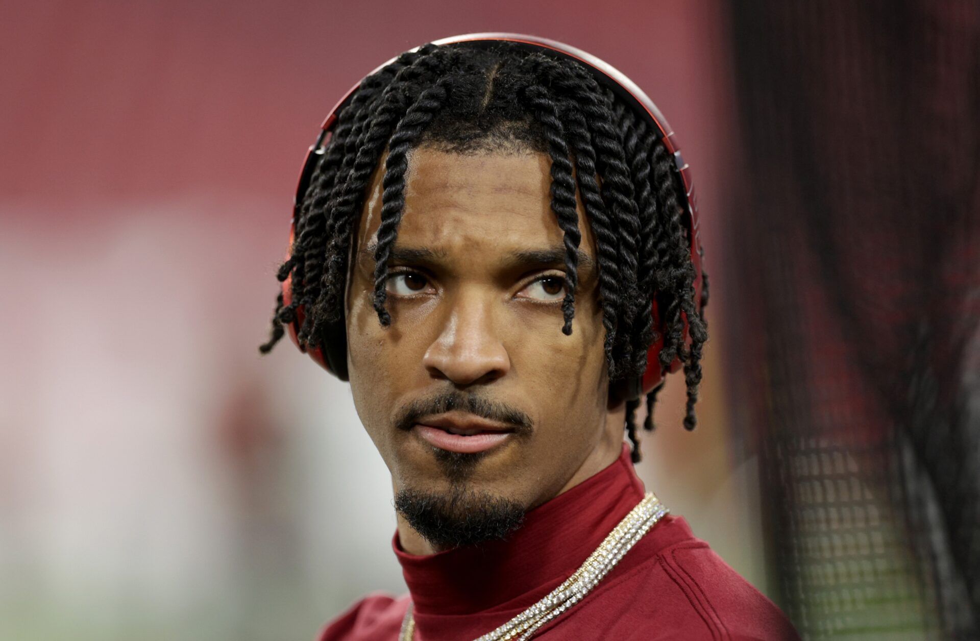 Washington Commanders quarterback Jayden Daniels (5) warms up before a NFC wild card playoff against the Tampa Bay Buccaneers at Raymond James Stadium.