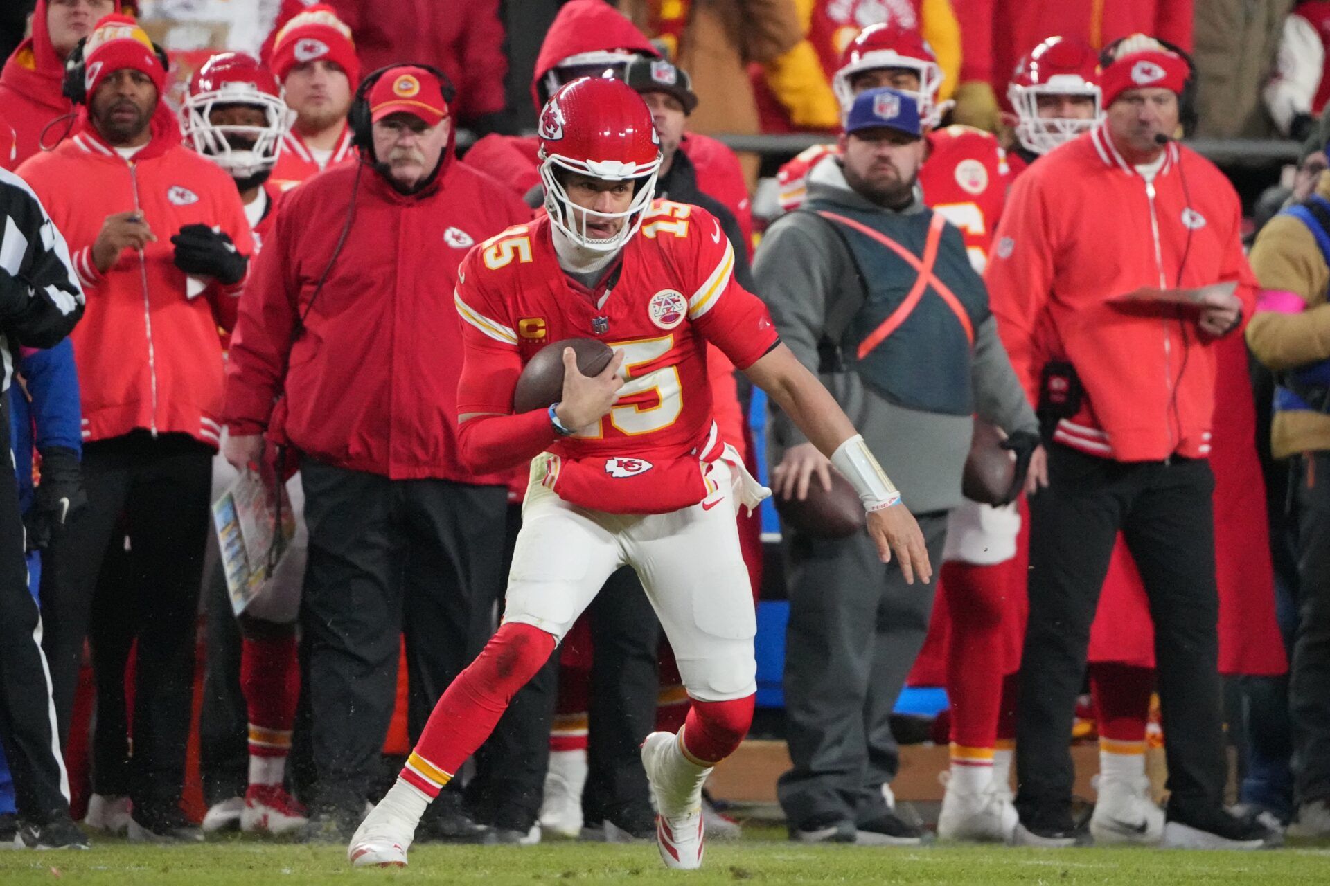 Kansas City Chiefs quarterback Patrick Mahomes (15) runs the ball against the Houston Texans during the fourth quarter of a 2025 AFC divisional round game at GEHA Field at Arrowhead Stadium.