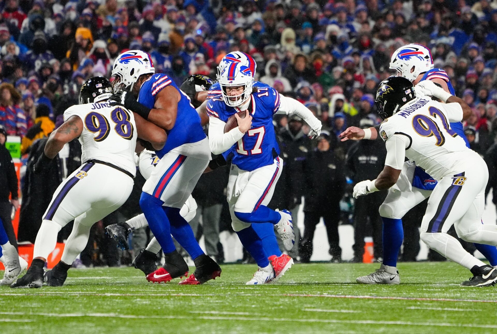 Buffalo Bills quarterback Josh Allen (17) runs the ball during the first quarter against the Baltimore Ravens in a 2025 AFC divisional round game at Highmark Stadium.