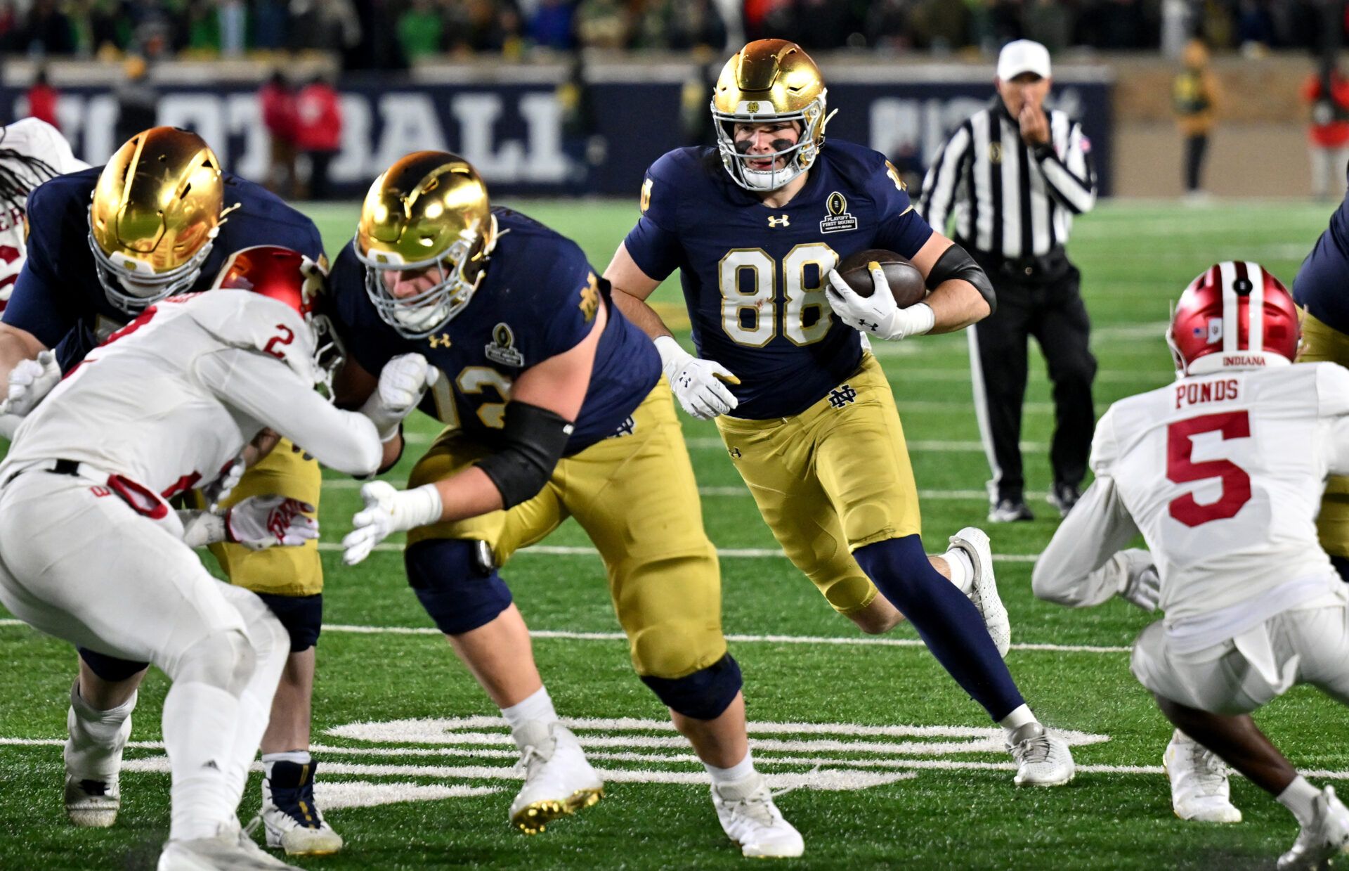 Dec 20, 2024; Notre Dame, Indiana, USA; Notre Dame Fighting Irish tight end Mitchell Evans (88) runs during the third quarter against the Indiana Hoosiers at Notre Dame Stadium. Mandatory Credit: Matt Cashore-Imagn Images