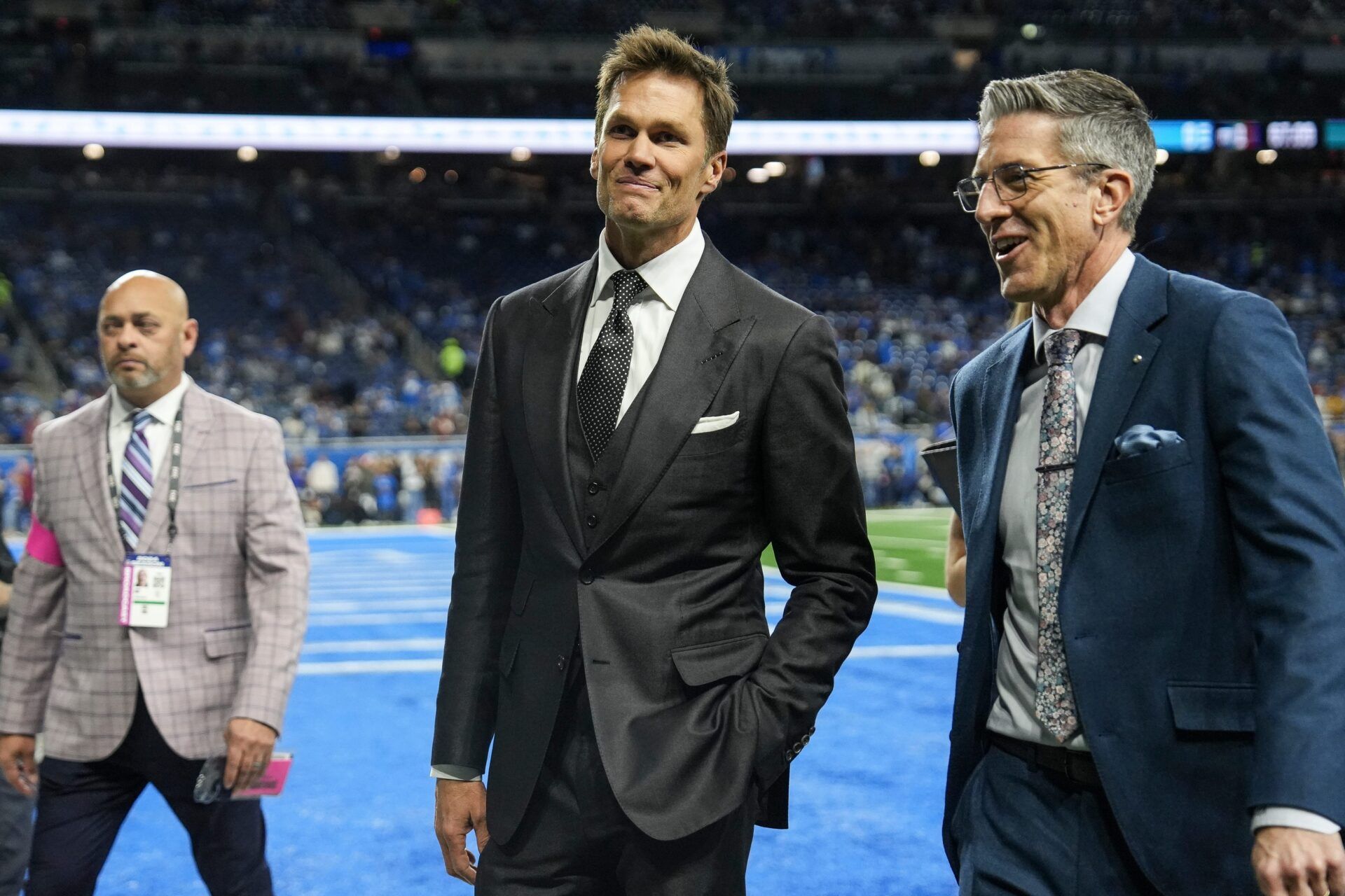 Tom Brady acknowledges fans as he walks into the tunnel before the NFC divisional round between Detroit Lions and Washington Commanders at Ford Field in Detroit on Saturday, Jan. 18, 2025.