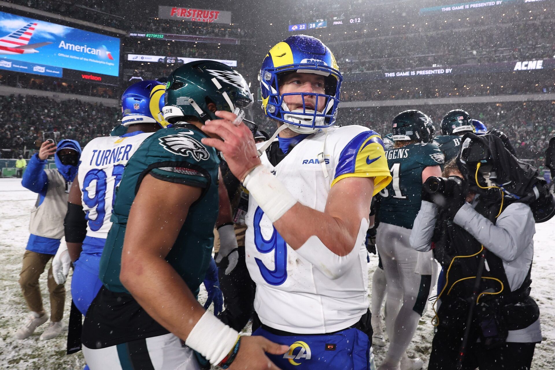 Philadelphia Eagles quarterback Jalen Hurts (1) greets Los Angeles Rams quarterback Matthew Stafford (9) after their game in a 2025 NFC divisional round game at Lincoln Financial Field.