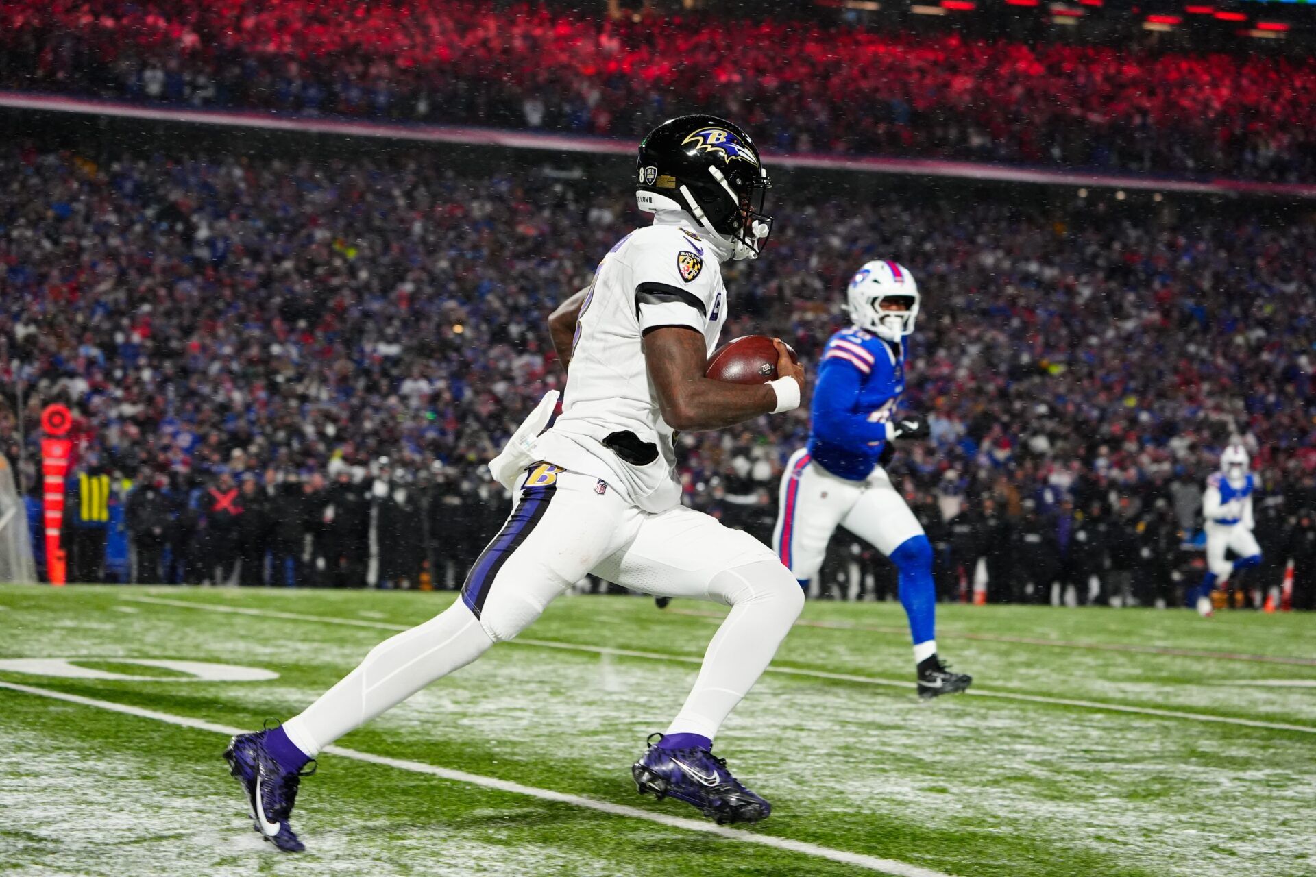 Baltimore Ravens quarterback Lamar Jackson (8) runs the ball during the fourth quarter against the Buffalo Bills in a 2025 AFC divisional round game at Highmark Stadium.