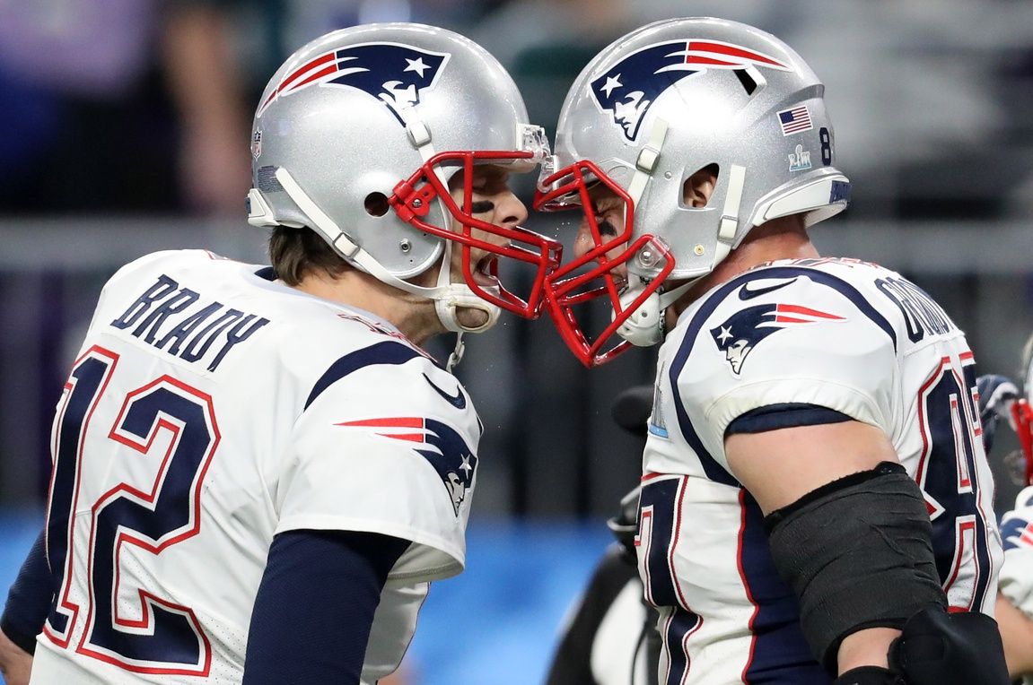 New England Patriots quarterback Tom Brady (12) and Rob Gronkowski (87) celebrate their third quarter touchdown against the Philadelphia Eagles in Super Bowl LII at U.S. Bank Stadium.