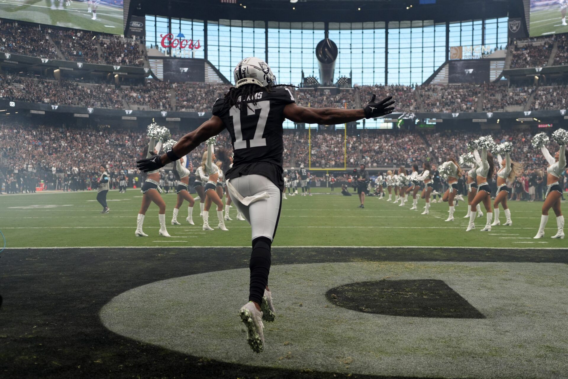 Las Vegas Raiders wide receiver Davante Adams (17) enters the field before the game against the Carolina Panthers at Allegiant Stadium.