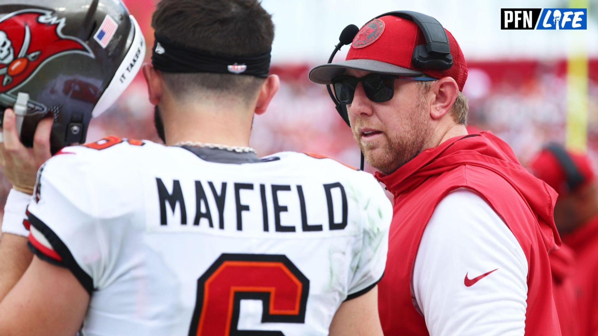 Tampa Bay Buccaneers quarterback Baker Mayfield (6) talks with offensive coordinator Liam Coen against the Washington Commanders during the first half at Raymond James Stadium.