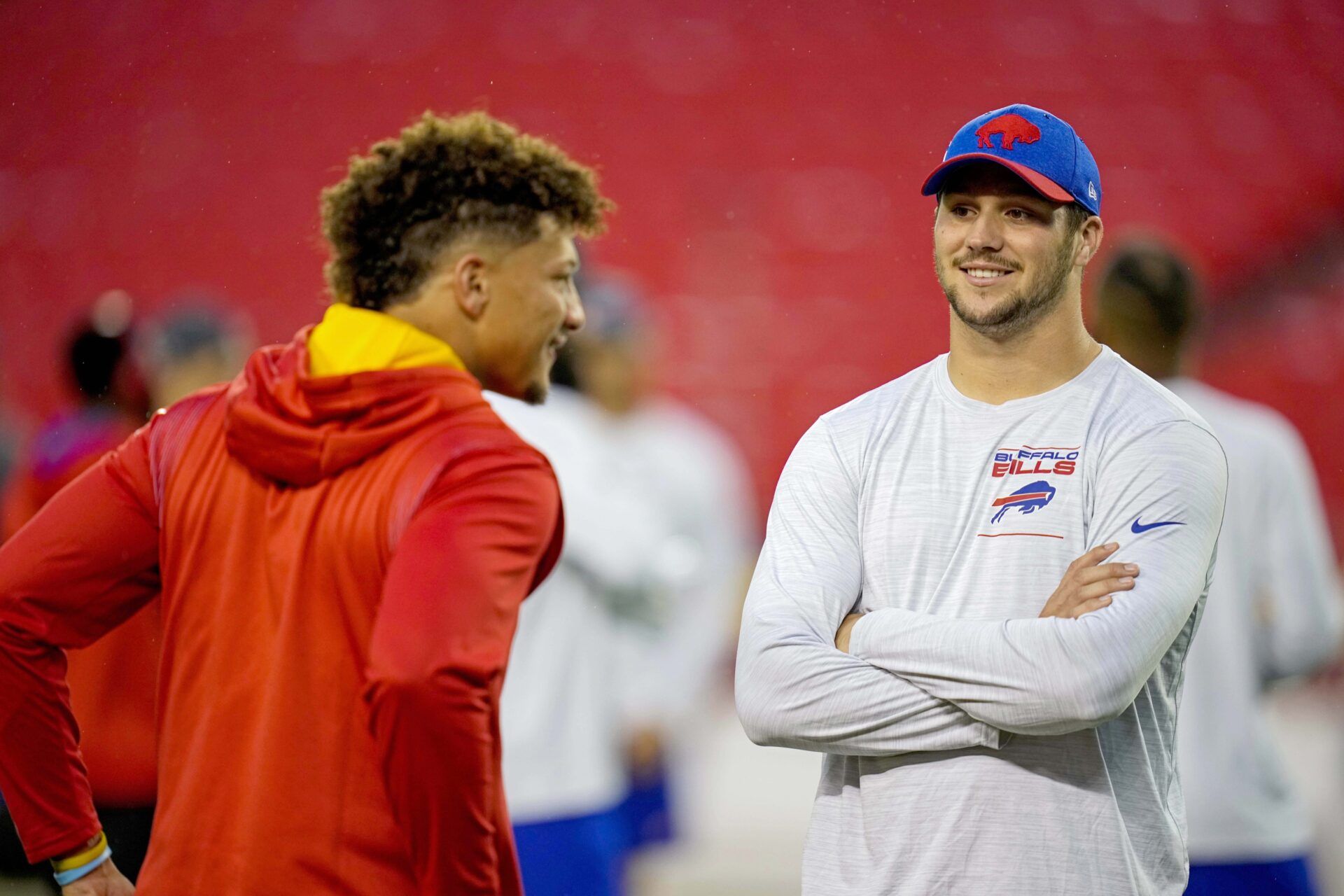 Buffalo Bills quarterback Josh Allen (17) talks with Kansas City Chiefs quarterback Patrick Mahomes (15) before the game at GEHA Field at Arrowhead Stadium.