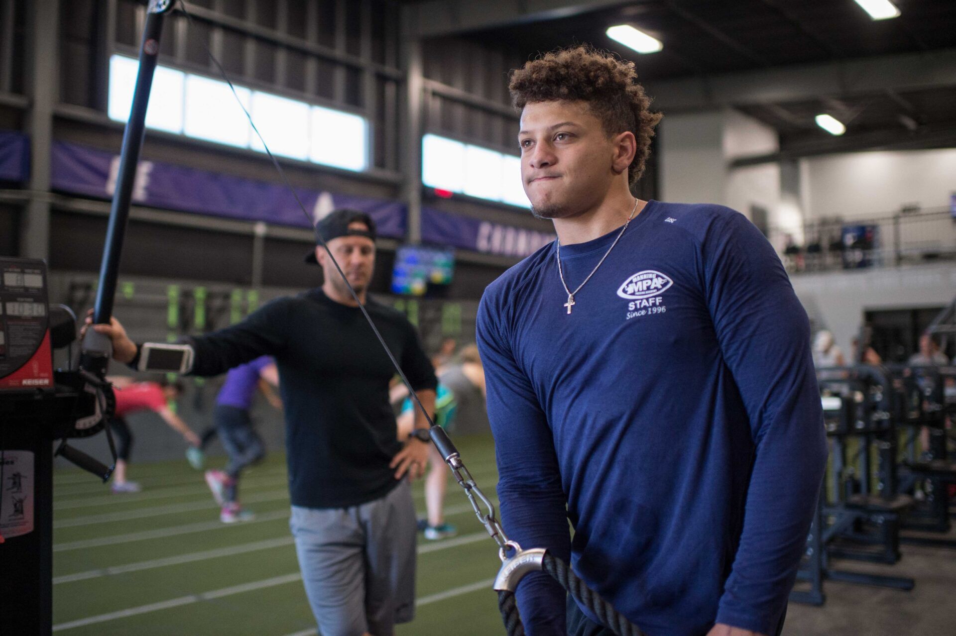 Patrick Mahomes (right), quarterback from the Texas Tech Red Raiders, trains at the APEC training facility in Tyler, TX with facility owner Bobby Stroupe (left).