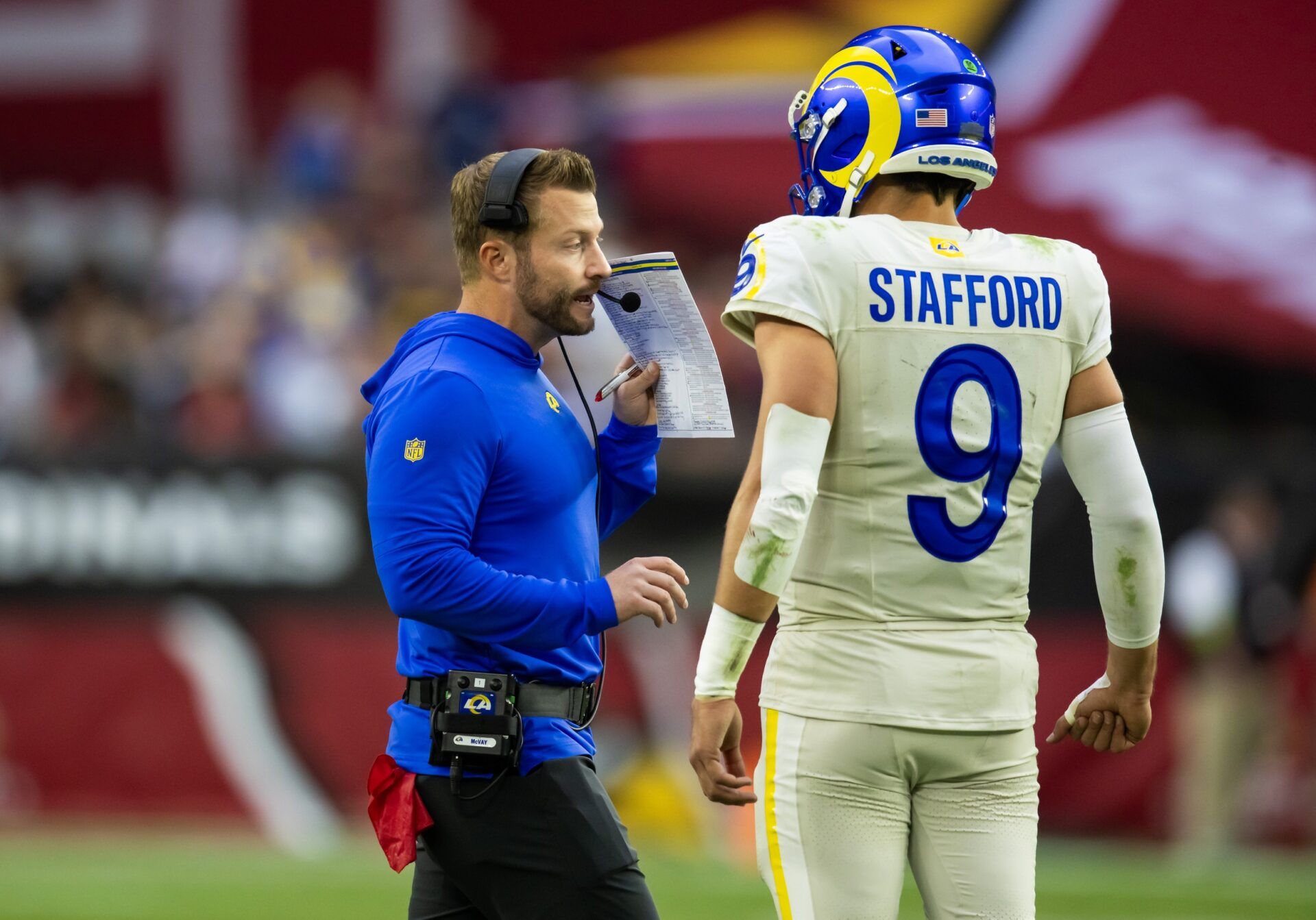 Los Angeles Rams head coach Sean McVay talks with quarterback Matthew Stafford (9) against the Arizona Cardinals at State Farm Stadium.