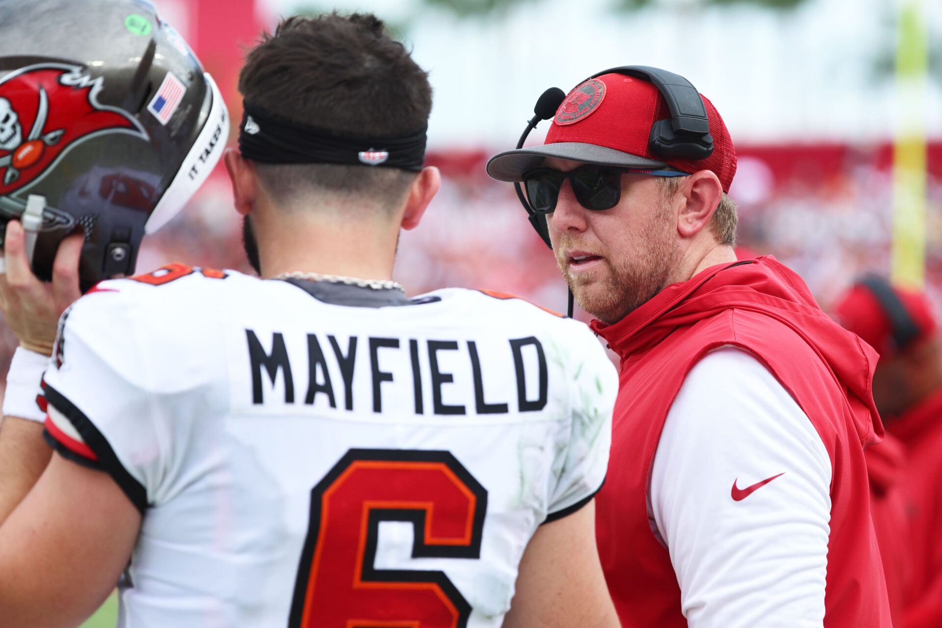 Sep 8, 2024; Tampa, Florida, USA; Tampa Bay Buccaneers quarterback Baker Mayfield (6) talks with offensive coordinator Liam Coen against the Washington Commanders during the first half at Raymond James Stadium. Mandatory Credit: Kim Klement Neitzel-Imagn Images