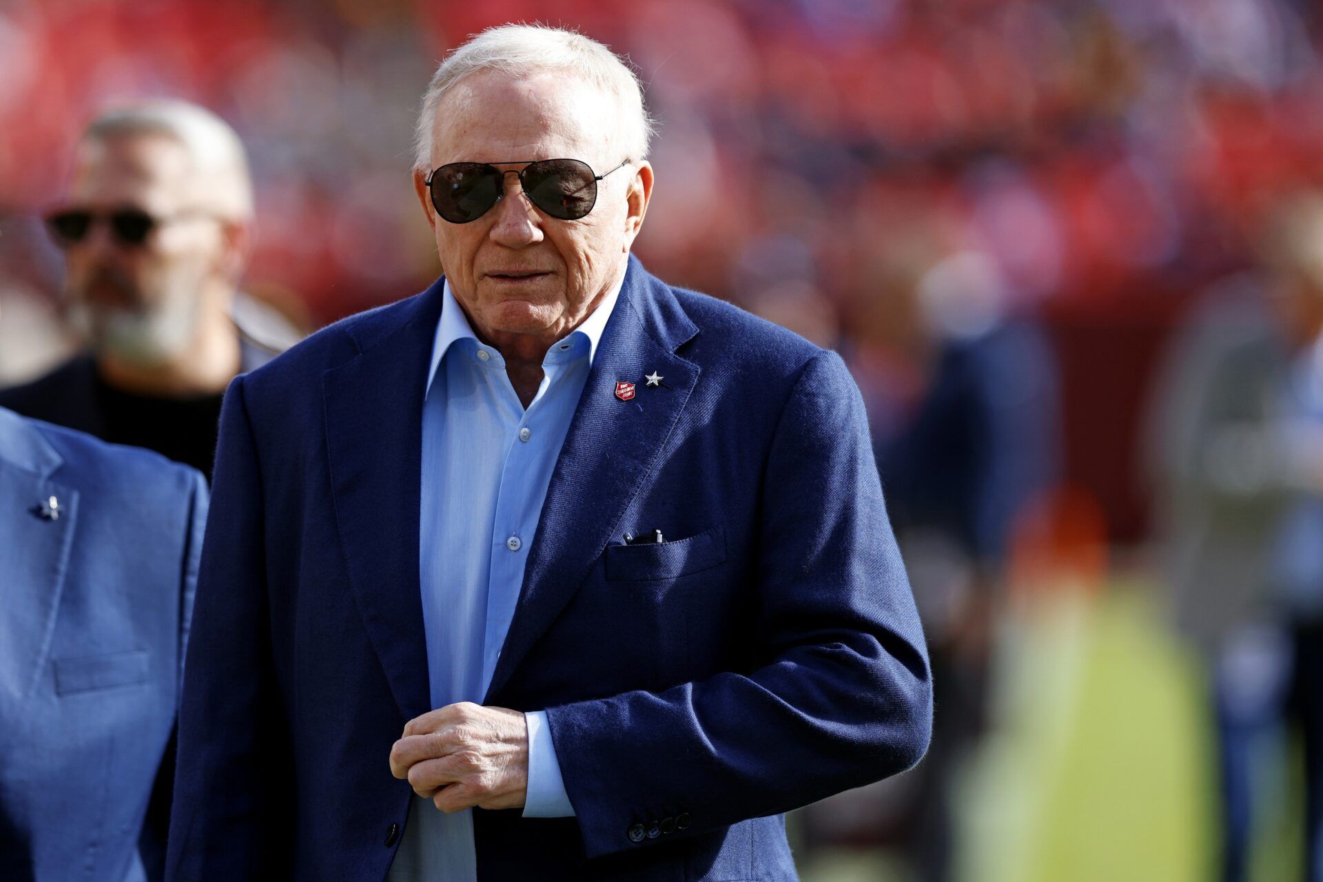 Dallas Cowboys owner Jerry Jones walks off the field before the game between the Washington Commanders and the Dallas Cowboys at Northwest Stadium.