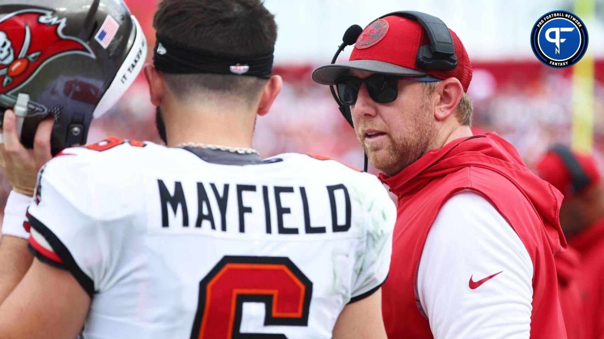 Tampa Bay Buccaneers quarterback Baker Mayfield (6) talks with offensive coordinator Liam Coen against the Washington Commanders during the first half at Raymond James Stadium.