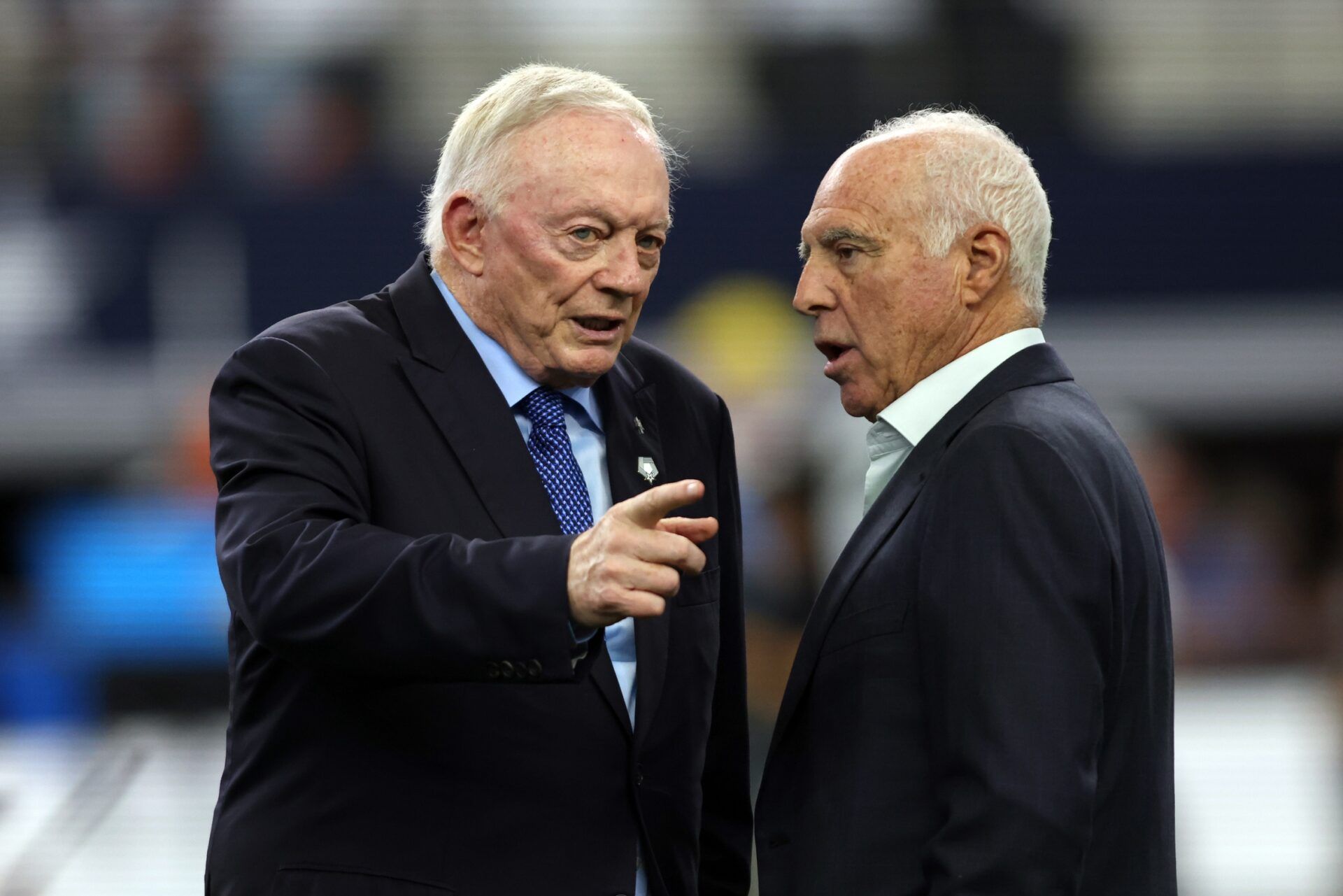 (L to R) Dallas Cowboys owner Jerry Jones talks to Philadelphia Eagles owner Jeffrey Lurie before the game at AT&T Stadium.