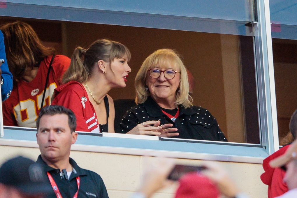 Grammy award winning artist Taylor Swift watches Kansas City Chiefs take the field along with Kansas City Chiefs tight end Travis Kelce (87) mom Donna Kelce prior to the game against the Denver Broncos at GEHA Field at Arrowhead Stadium.