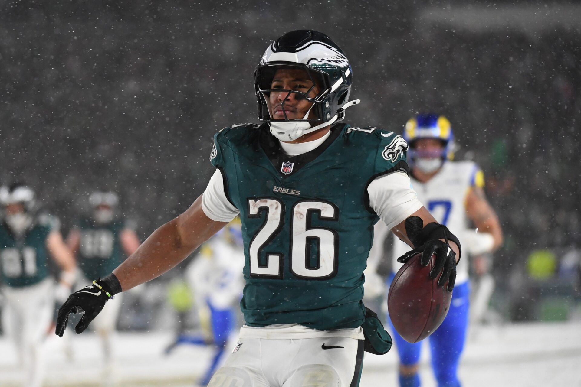 Philadelphia Eagles running back Saquon Barkley (26) celebrates after scoring a touchdown against the Los Angeles Rams in the second half in a 2025 NFC divisional round game at Lincoln Financial Field.