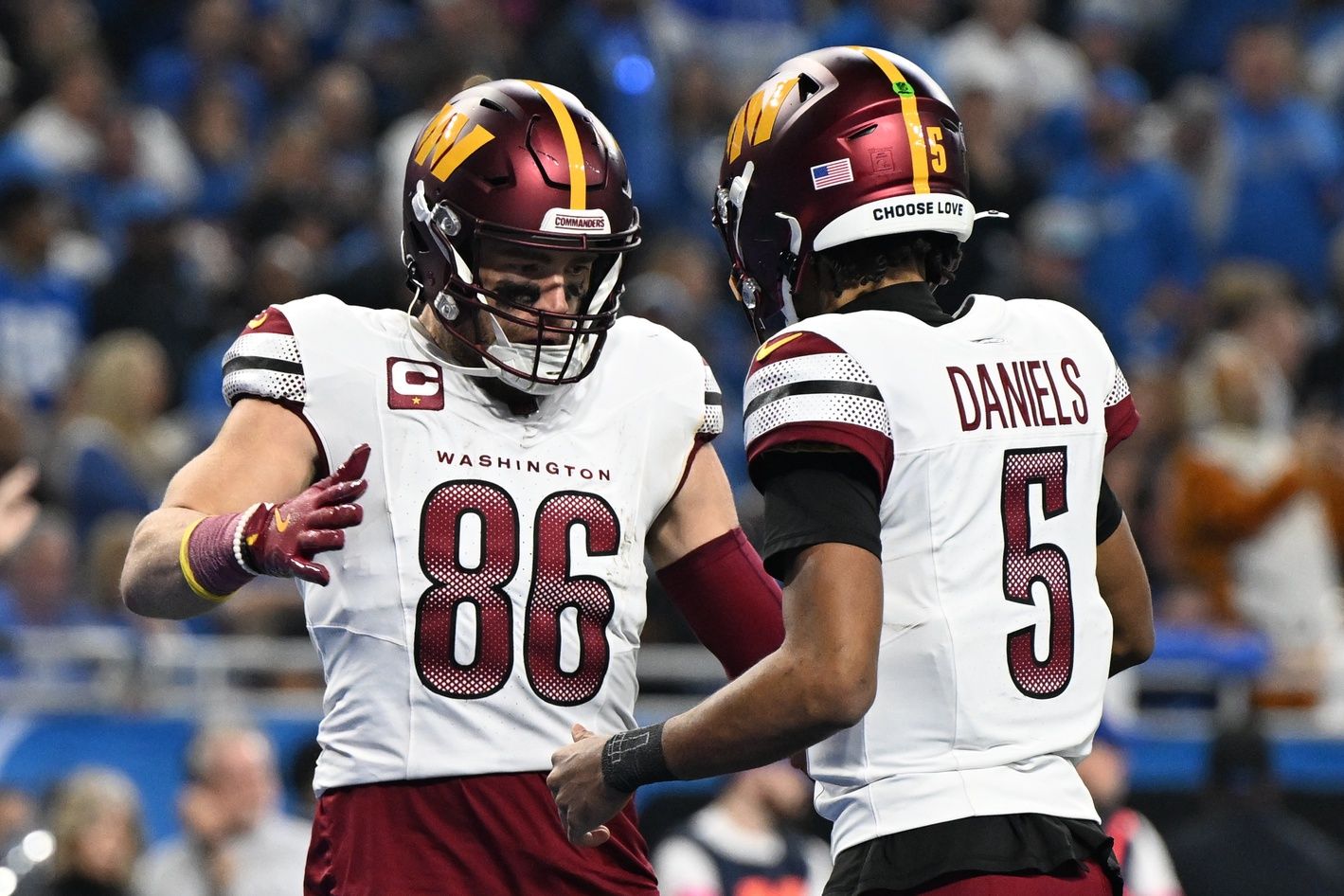 Washington Commanders tight end Zach Ertz (86) celebrates touchdown pass with quarterback Jayden Daniels (5) during the second quarter in a 2025 NFC divisional round game at Ford Field.